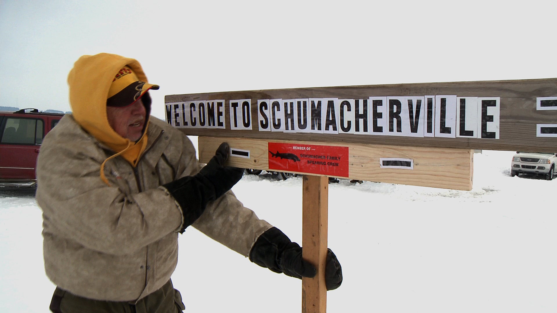 Bill Schumacher with the family sign on the ice