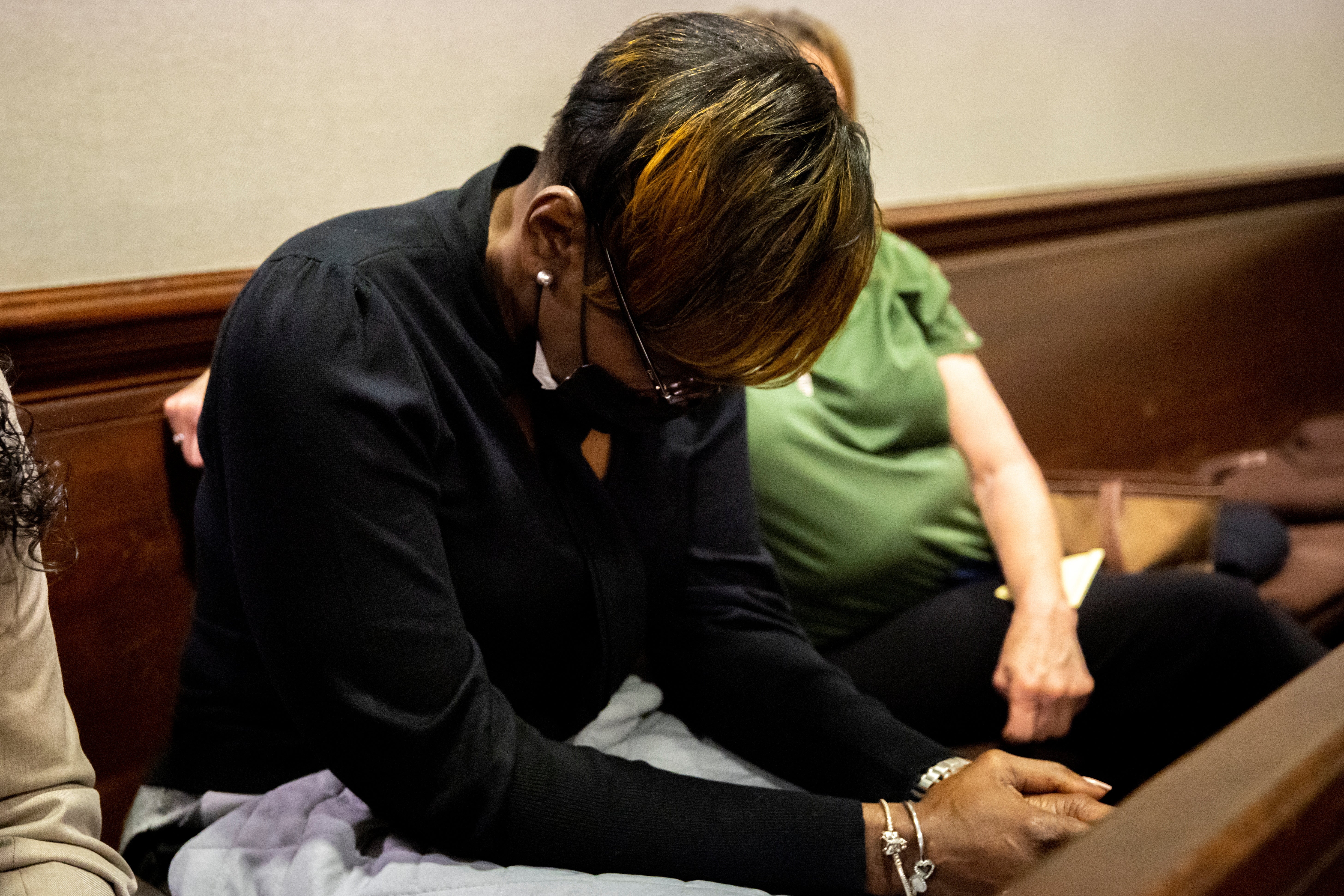 Ahmaud Arbery’s mother Wanda Cooper-Jones hangs her head as her son’s autopsy photos are shown to the court on Tuesday