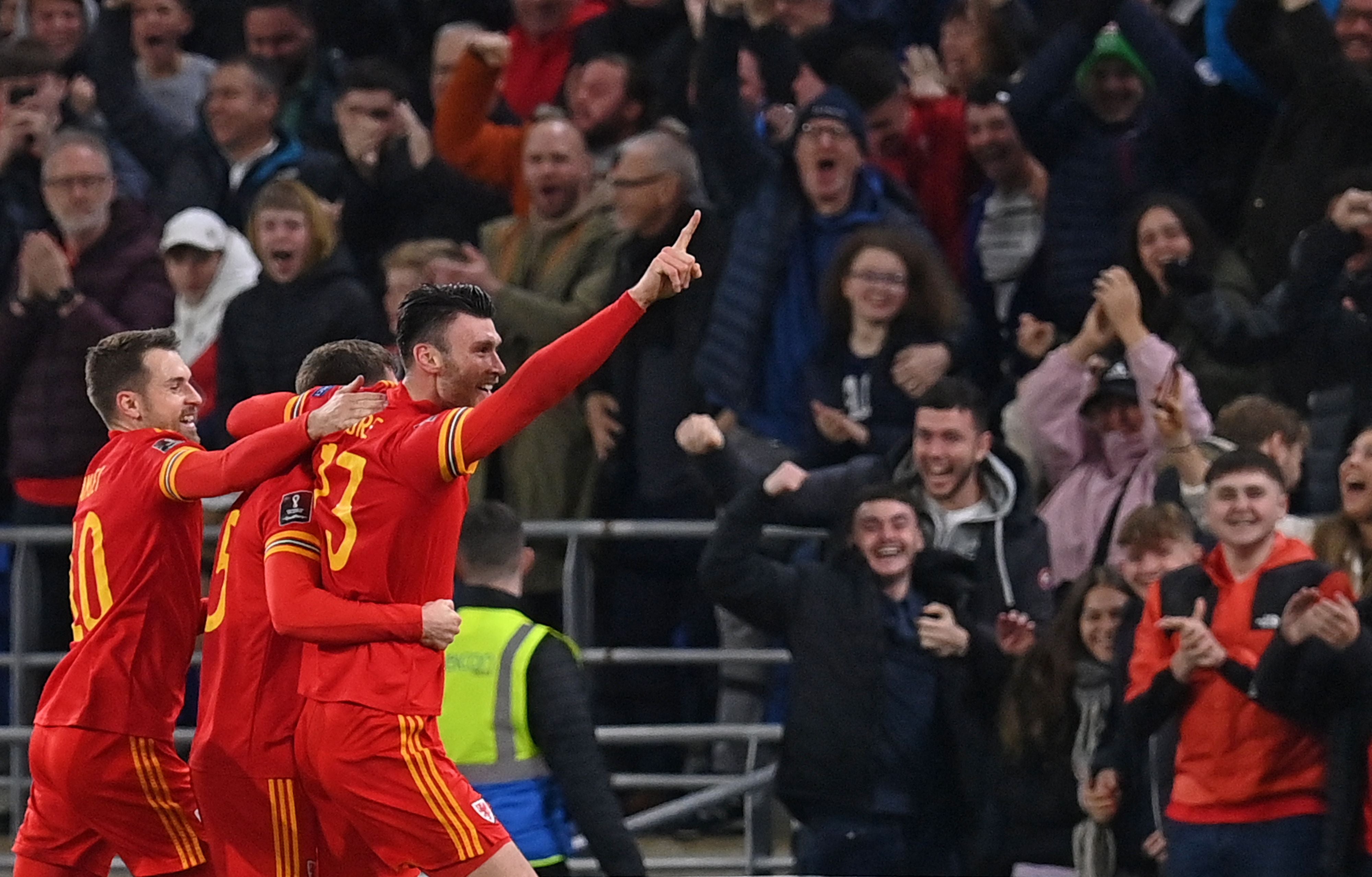 Kieffer Moore (R) celebrates after scoring the equalising goal