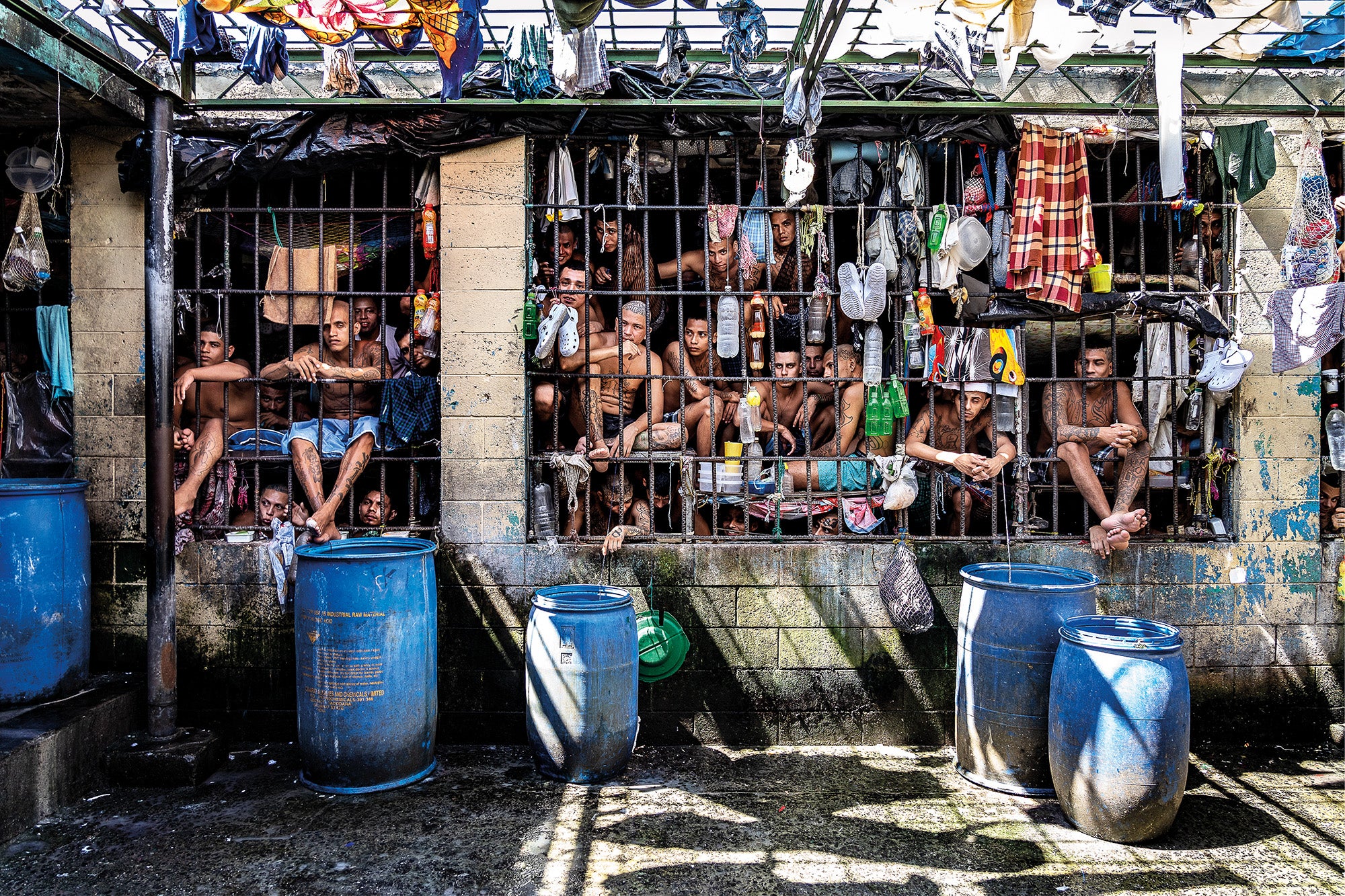 Inmates look out of a cell in a section where ‘extraordinary measures’ were introduced in the Penal Centre of Quezaltepeque