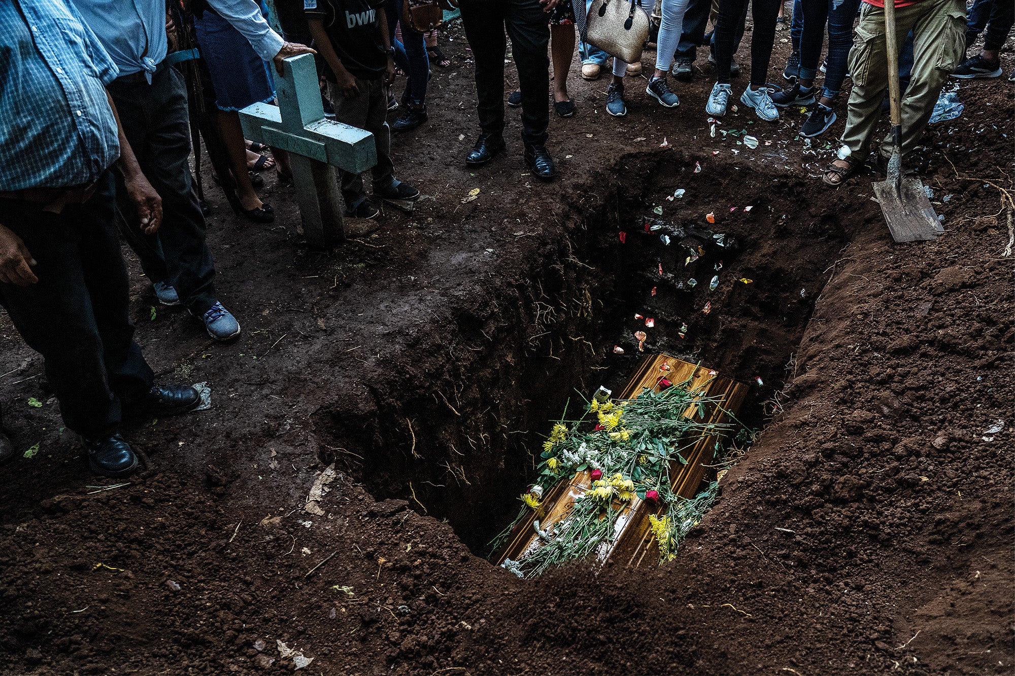 The burial of a young alleged gang member, aged 22, in Chapeltique Municipal Cemetery, in San Miguel. He was one of four people killed during a confrontation with agents of special operations police units in a jungle camp