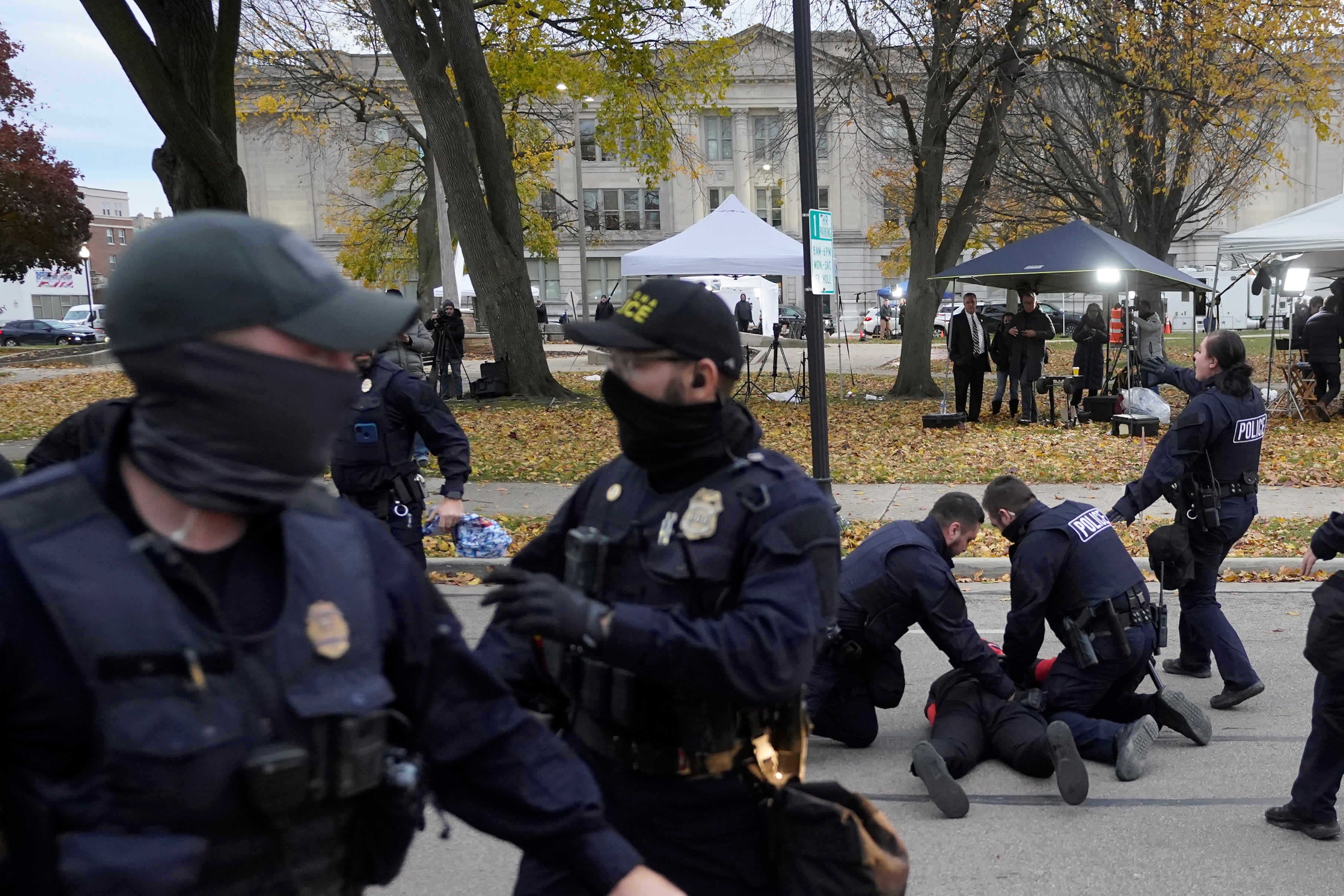 A protester is taken into custody by police outside the Kenosha County Courthouse, Wednesday, Nov. 17, 2021 in Kenosha, Wis., during the Kyle Rittenhouse murder trial.