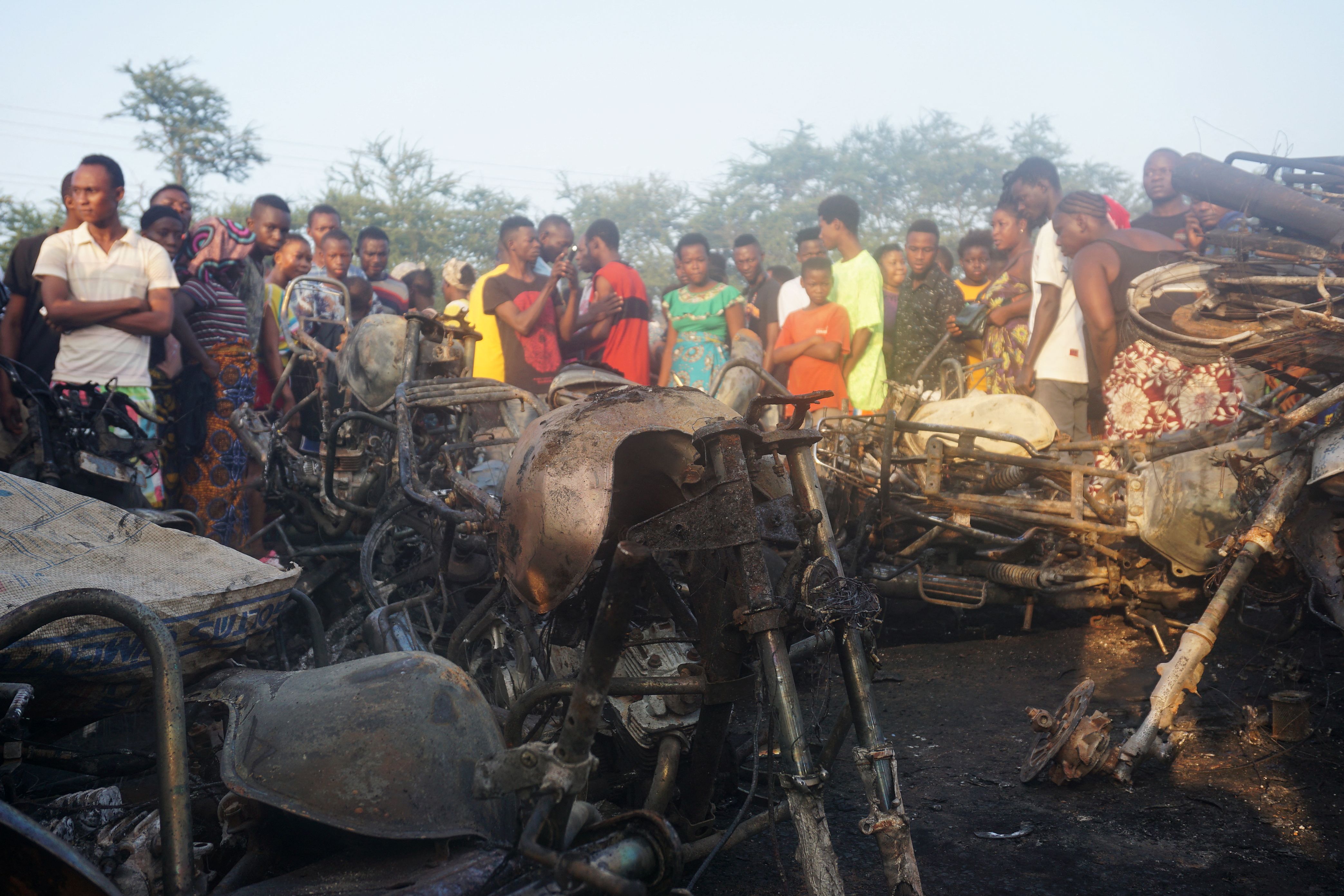 People in Freetown gather at the site of the oil tanker explosion