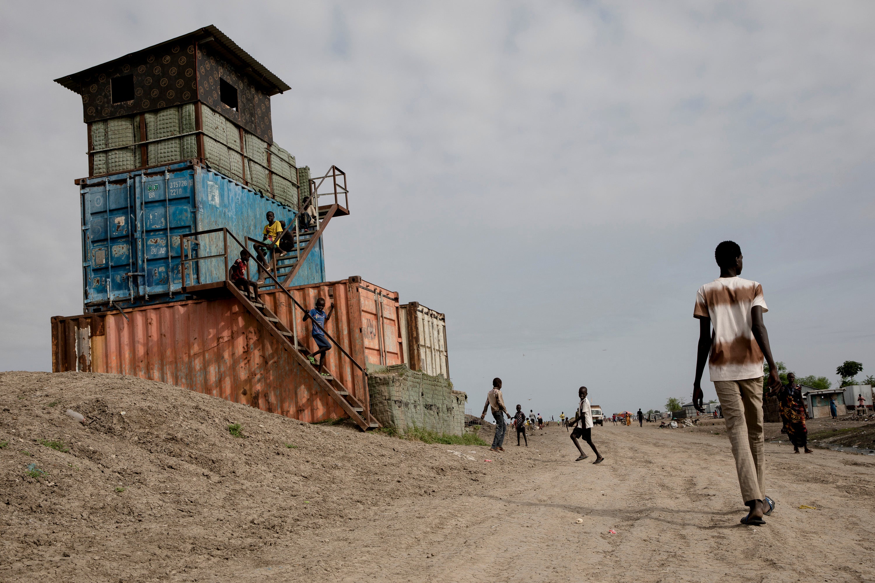 Children play on an abandoned UN lookout post in the Bentiu displacement camp