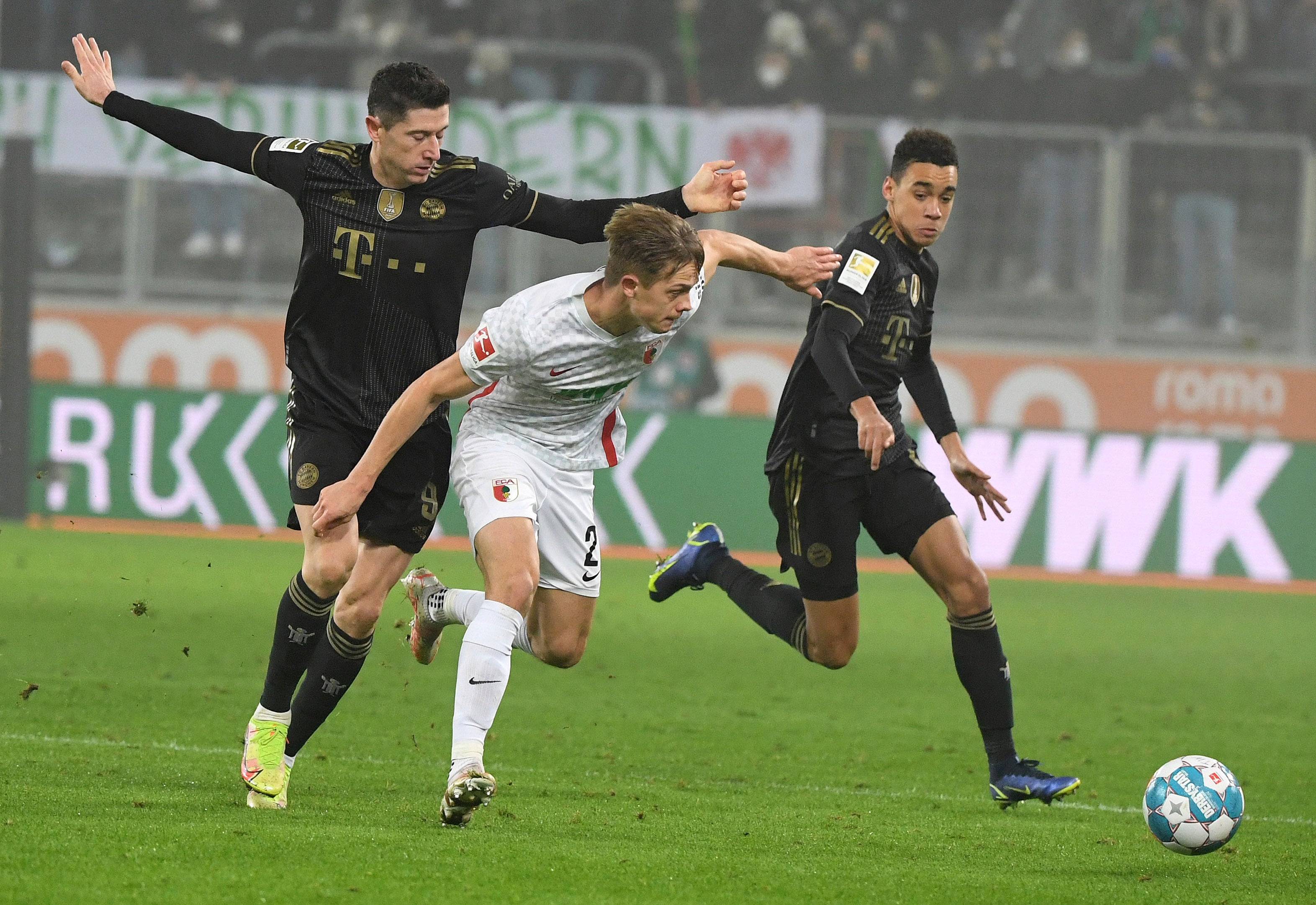 Bayern Munich (in black) were beaten 2-1 at Augsburg on Friday (Matthias Balk/AP).