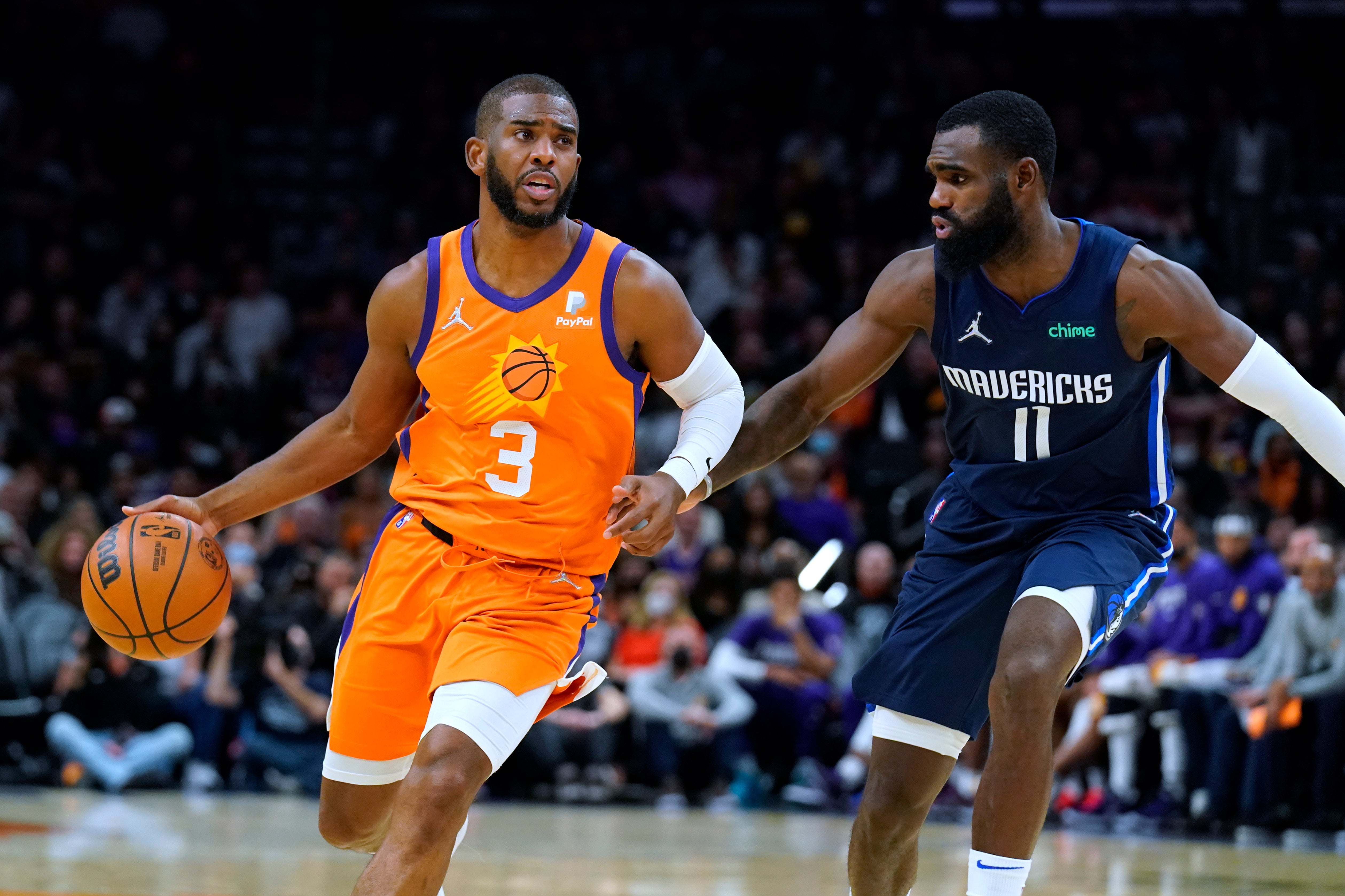 Phoenix Suns guard Chris Paul (3) drives as Dallas Mavericks forward Tim Hardaway Jr defends (Rick Scuteri/AP)