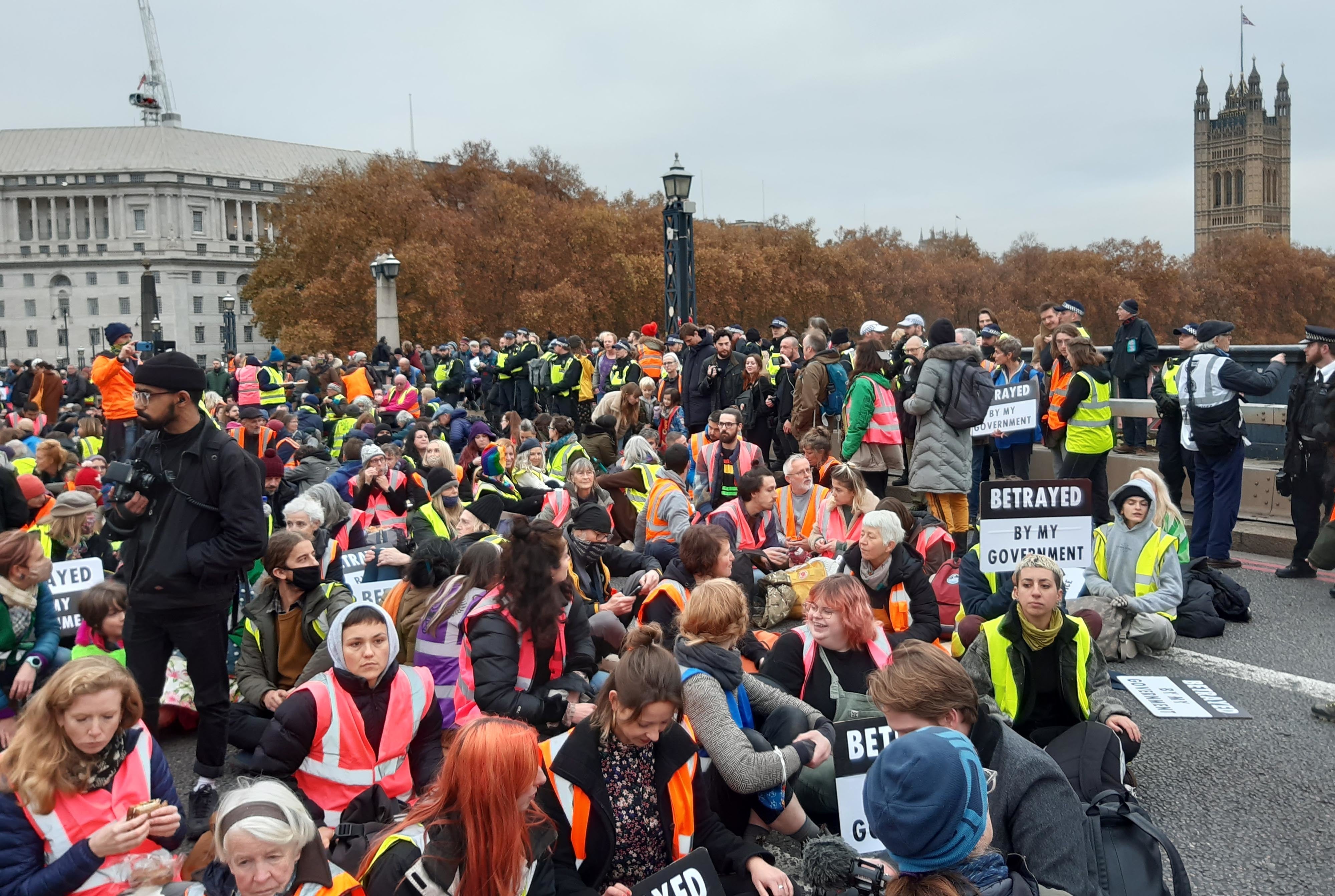 Supporters of the jailed Insulate Britain protesters on Lambeth Bridge in London