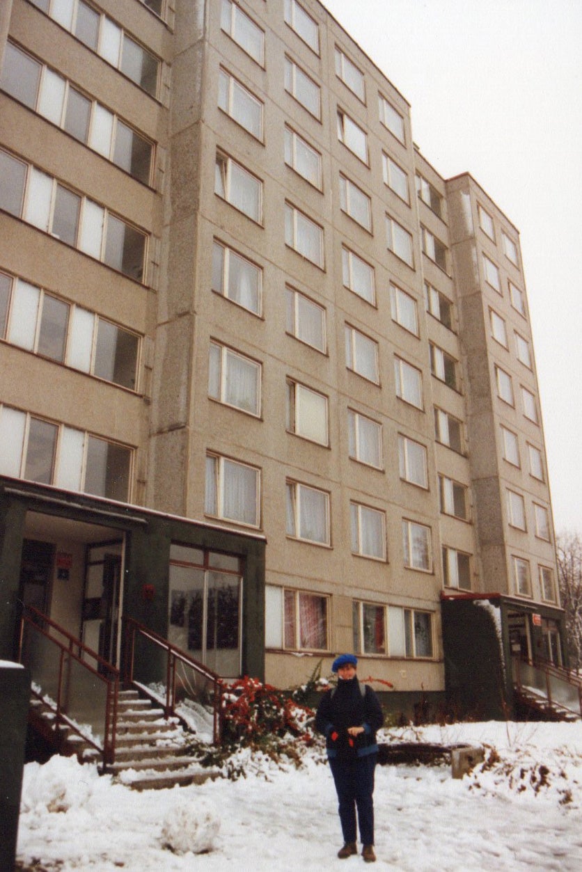 Sally outside their Prague apartment (note the beret from Budapest)