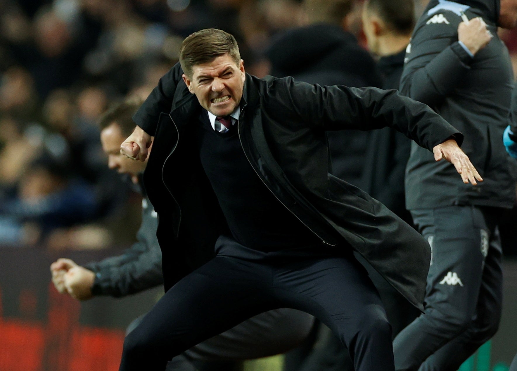 Steven Gerrard celebrates on the touchline