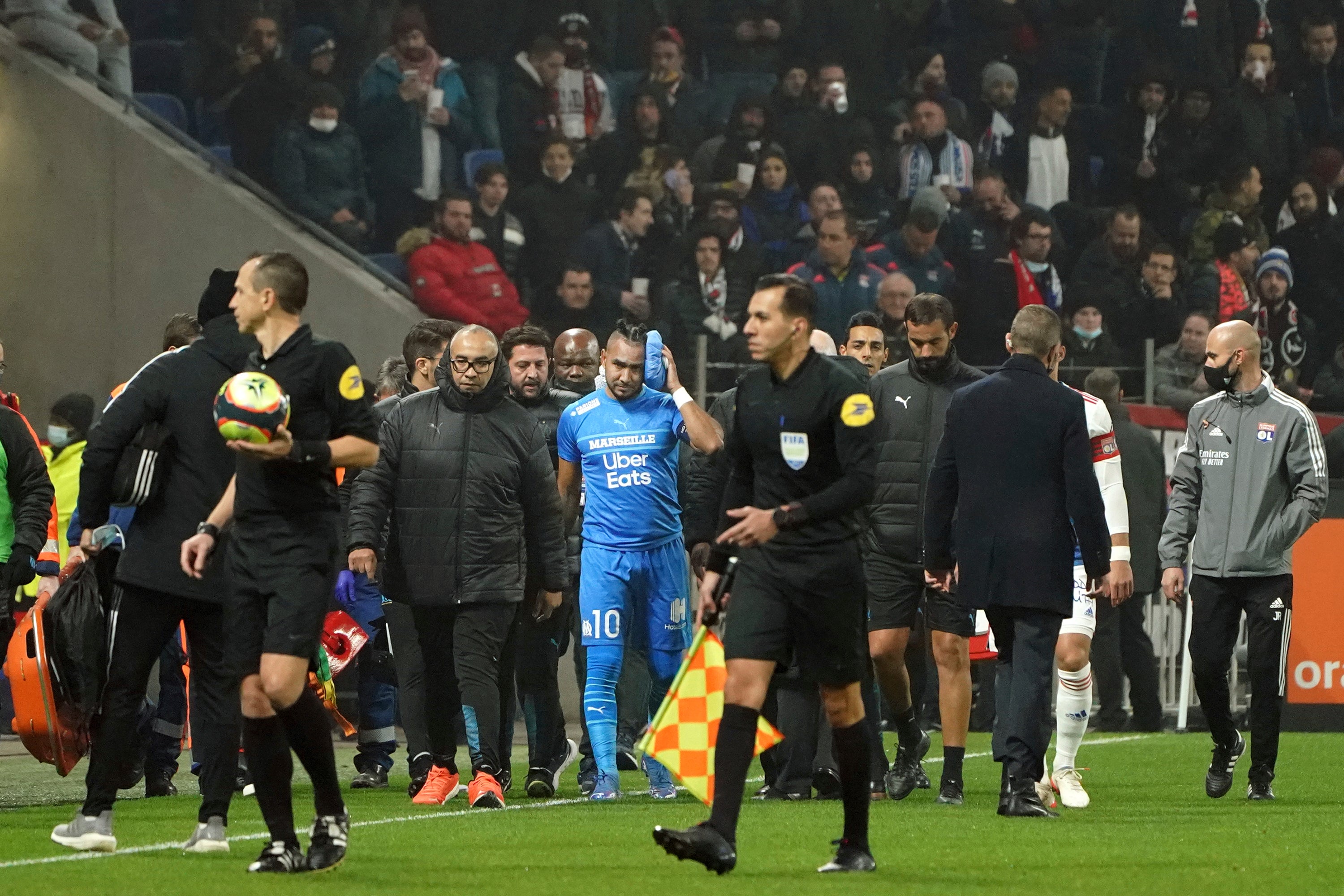 Dimitri Payet was hit by a bottle thrown from the crowd (Laurent Cipriani/AP)