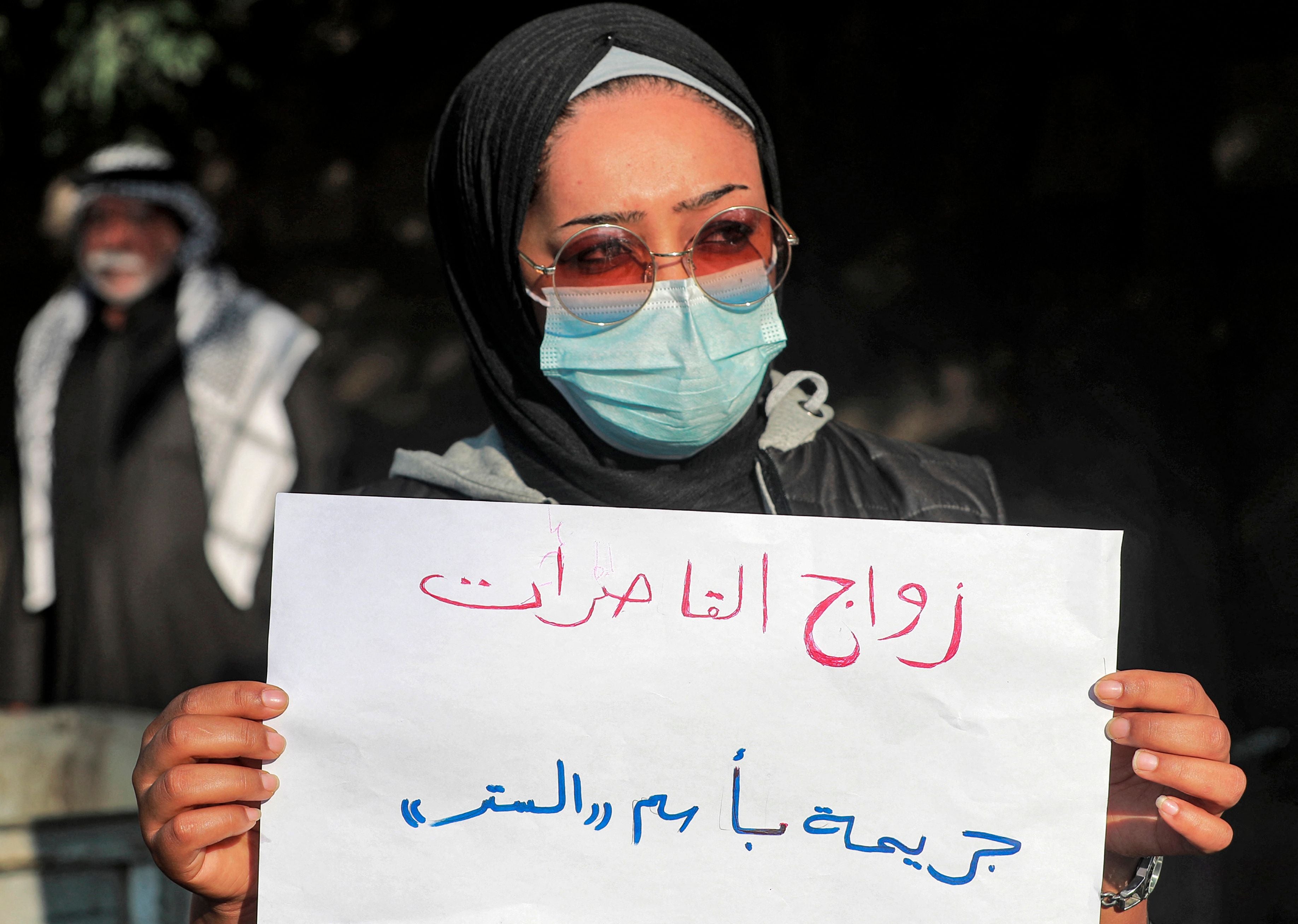 Women demonstrate near the Kadhimiya court in Iraq's capital Baghdad in protest against the legalisation of a marriage contract for a 12-year-old girl