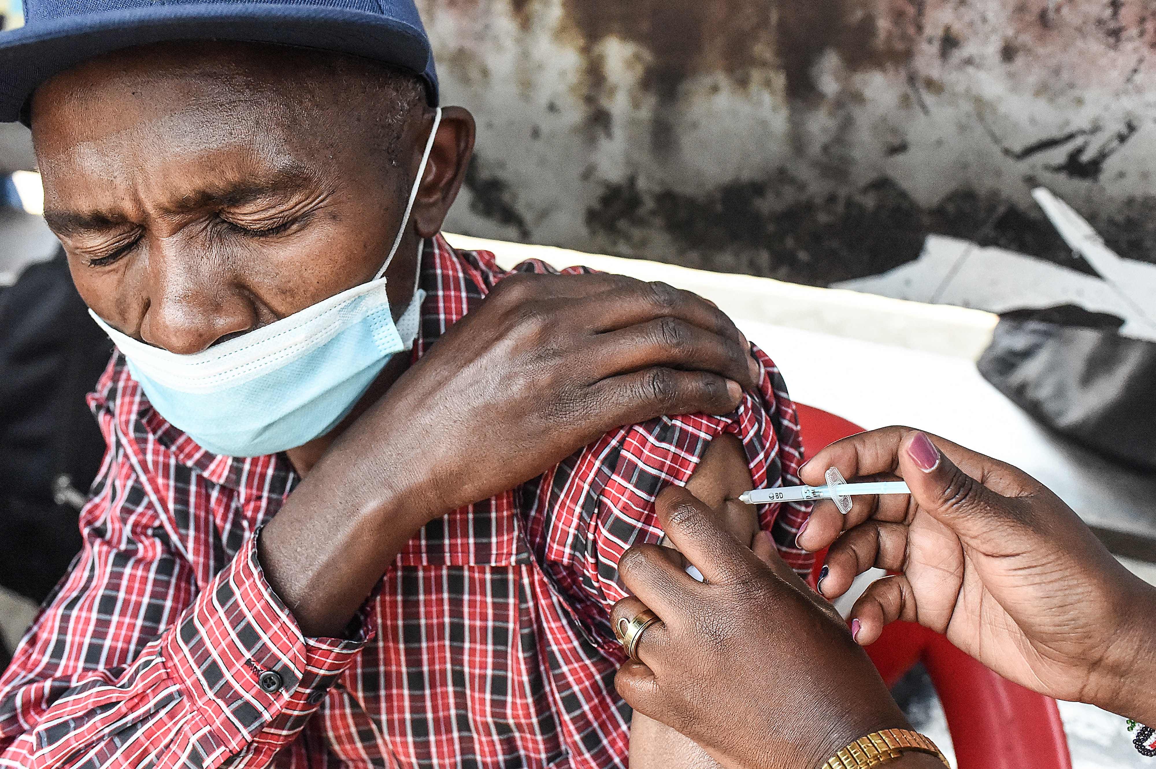 A Kenyan man receives his Covid-19 vaccine in Nairobi