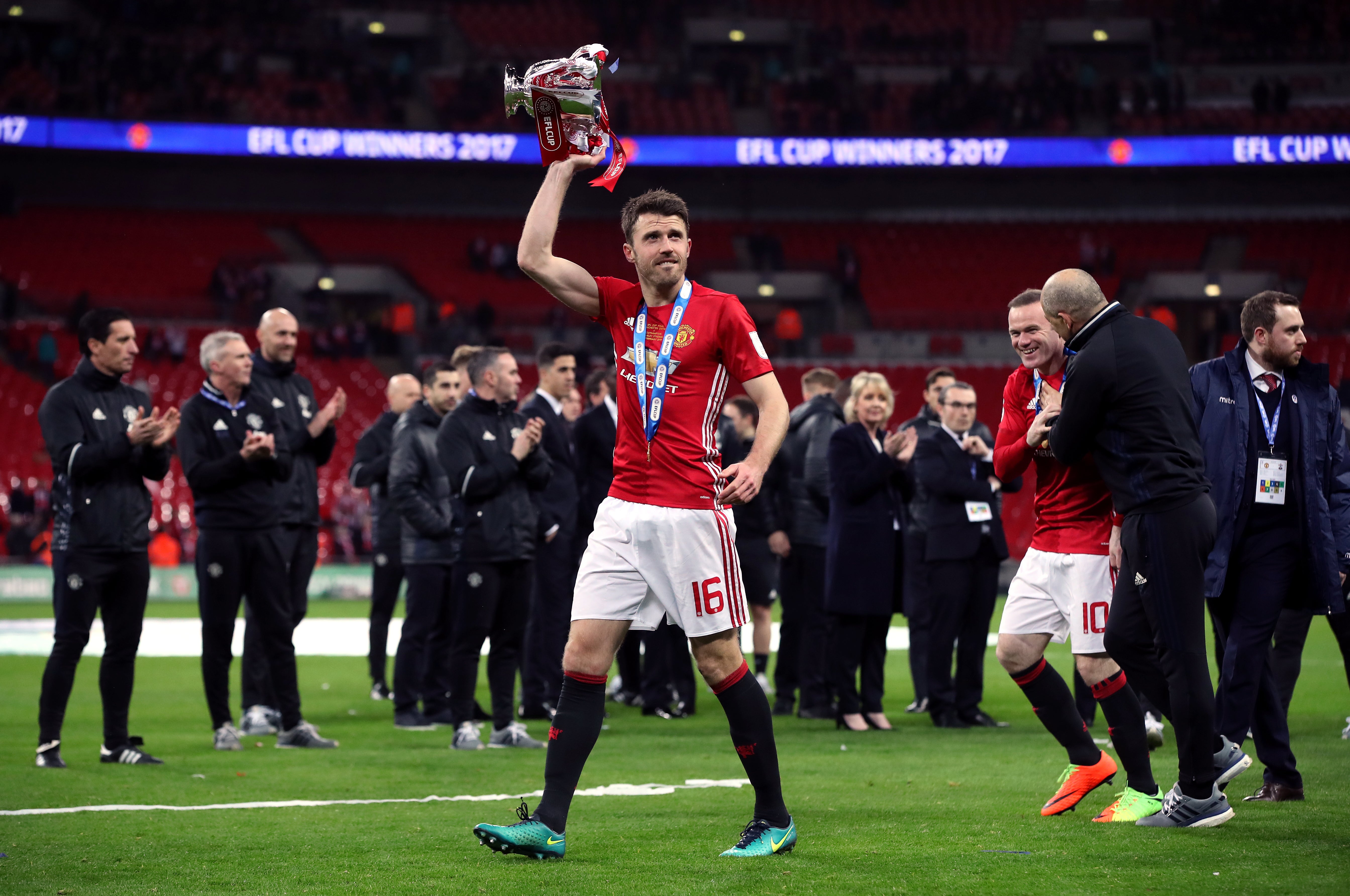 Michael Carrick lifts the EFL Trophy (Nick Potts/PA)