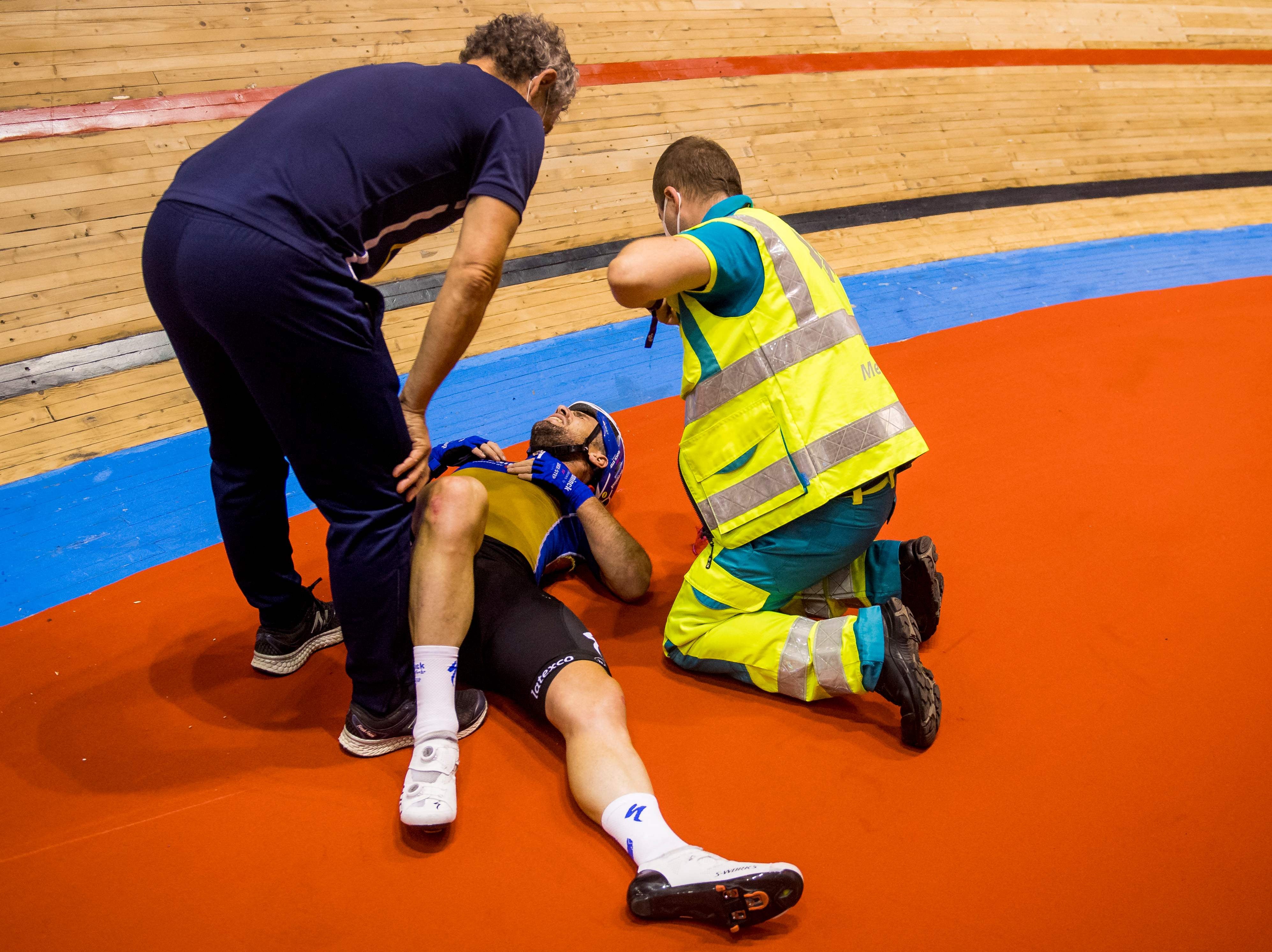 Mark Cavendish receives care after crashing in Ghent