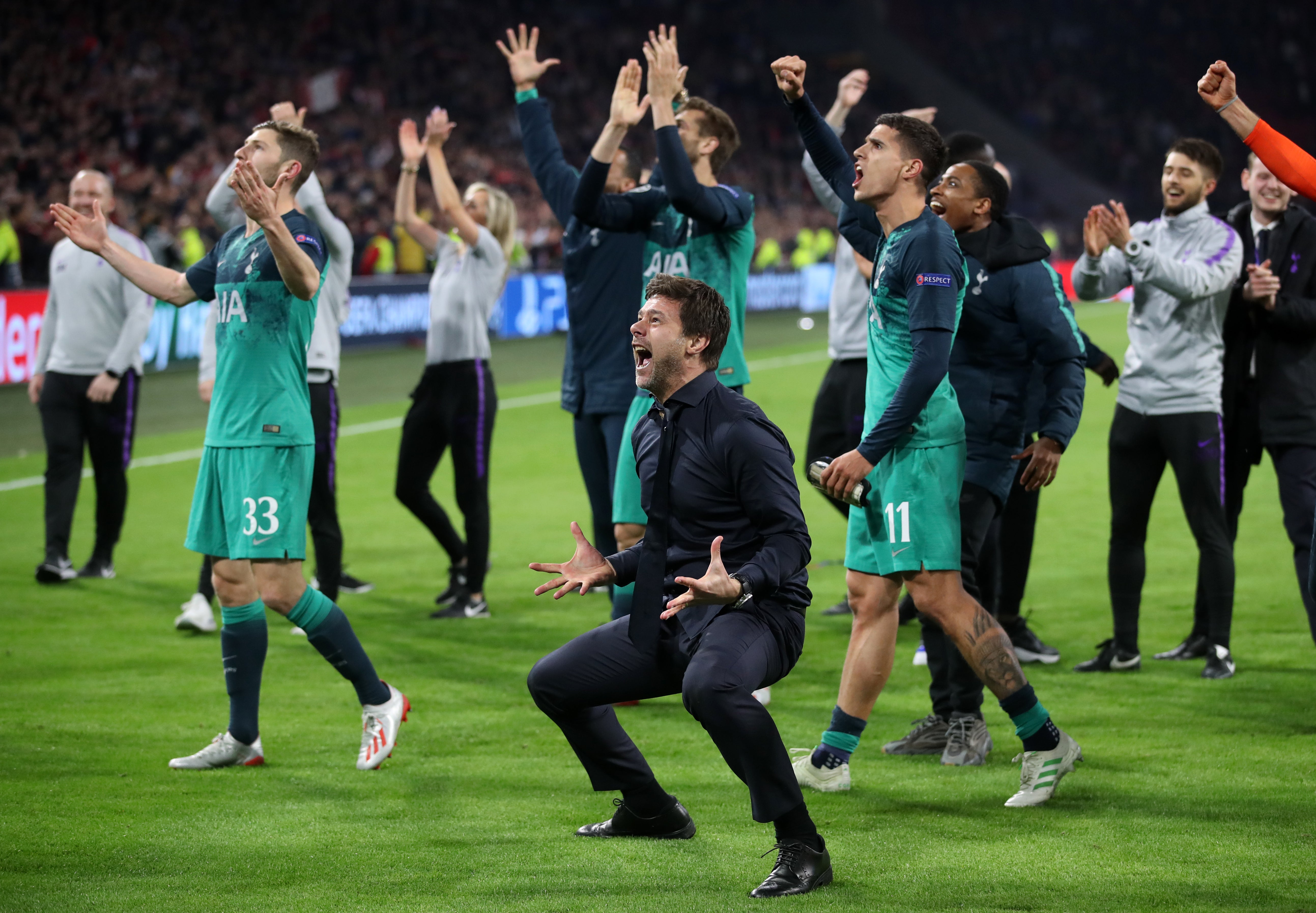 Pochettino, front, centre, celebrates taking Tottenham to the Champions League final (Adam Davy/PA)