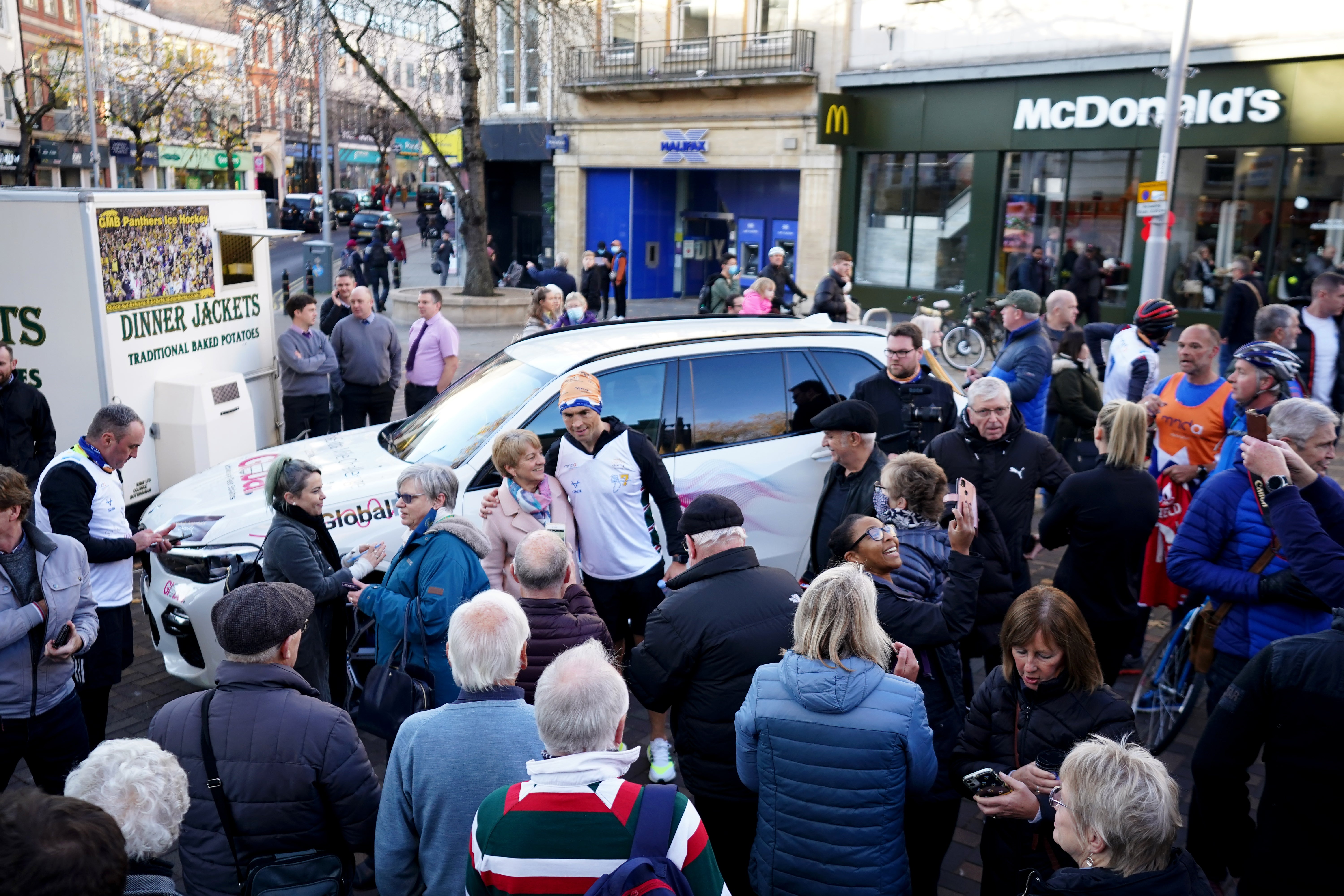 Kevin Sinfield posed for photographs with supporters during his run from Leicester to Leeds (Zac Goodwin/PA)