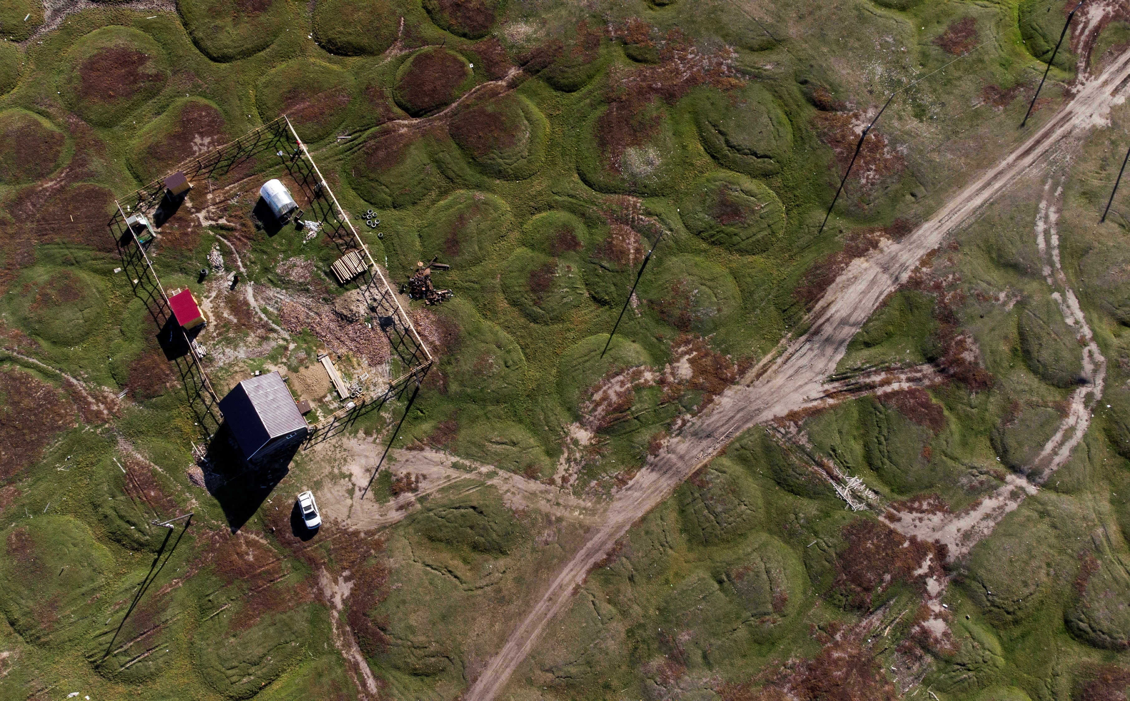 A house located on land that has been deformed by permafrost thaw