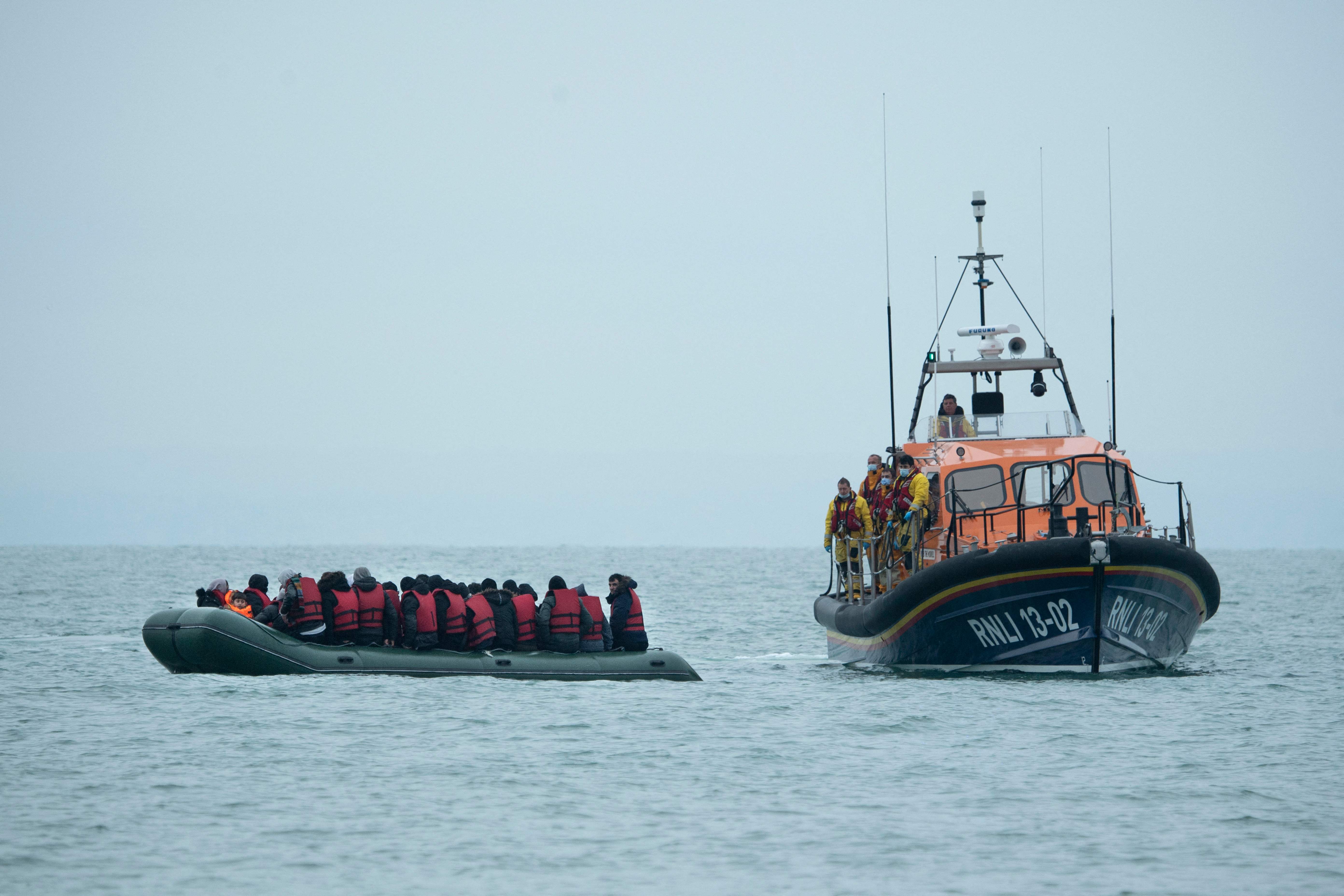 Migrants are helped by RNLI off the south-east coast of England on 24 November