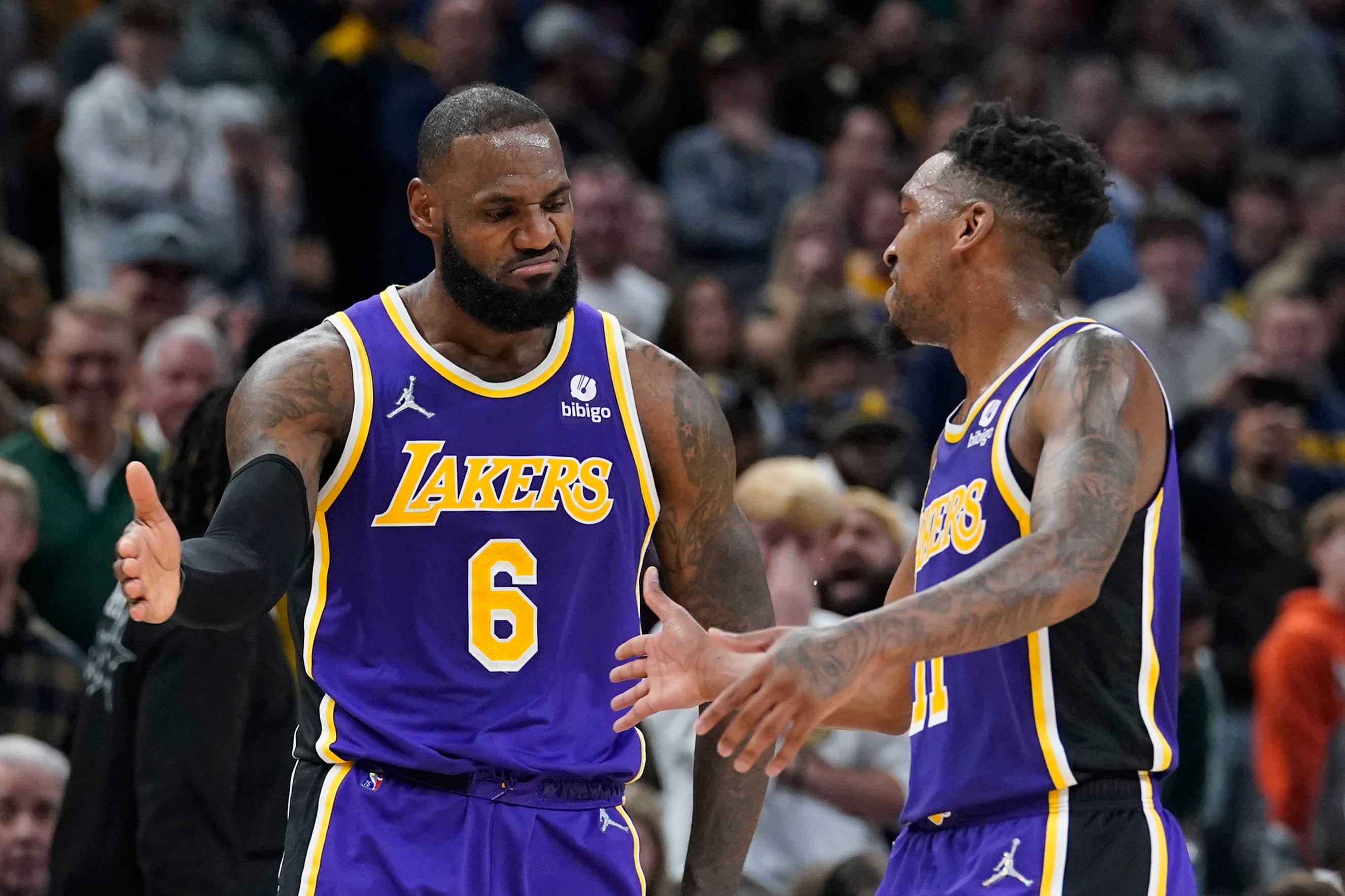 LeBron James, left, marked his return with a fine performance (Darron Cummings/AP)