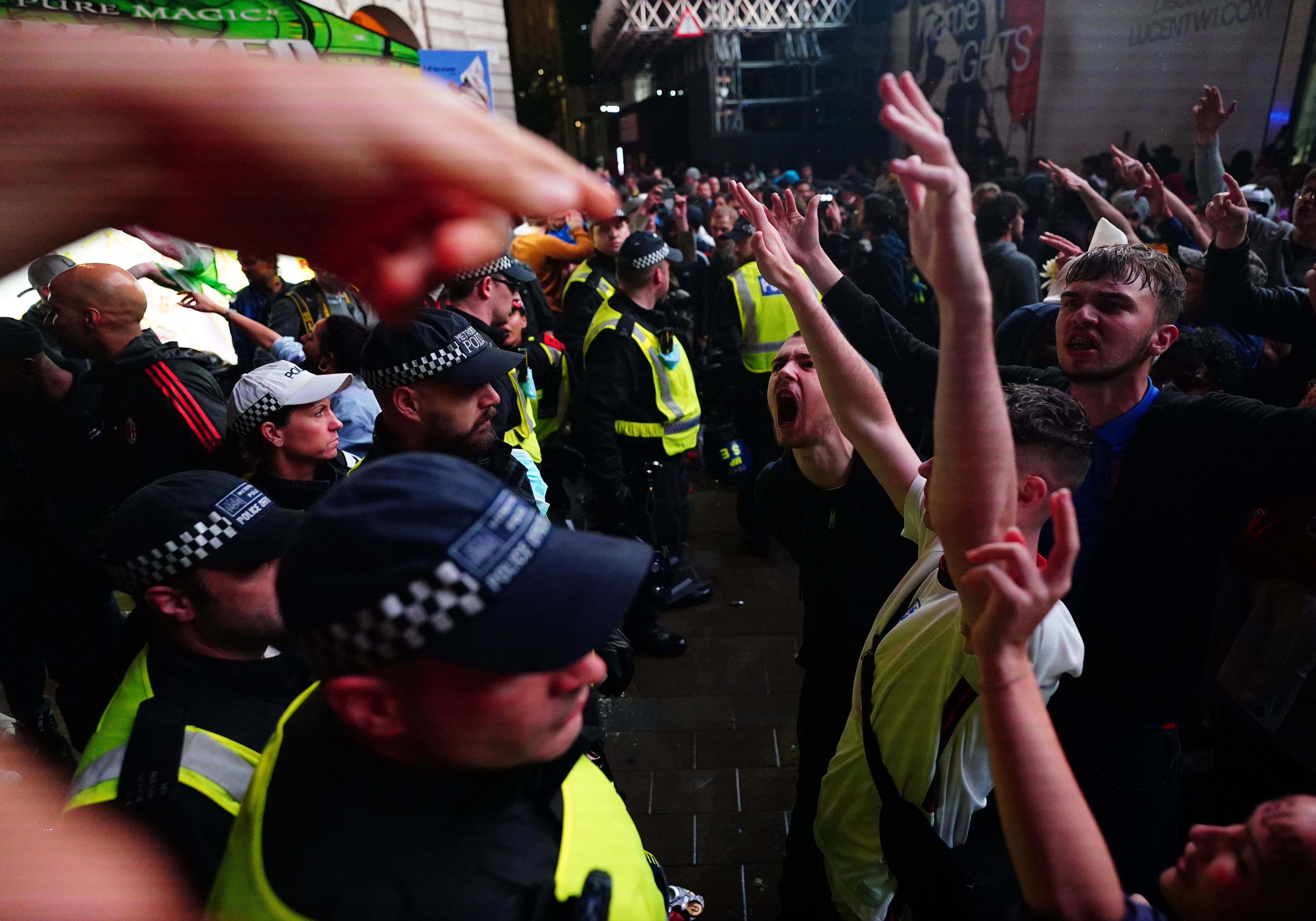 England fans clash with police in London’s Piccadilly Circus after Italy beat England on penalties to win the Euro 2020 final (Victoria Jones/PA)