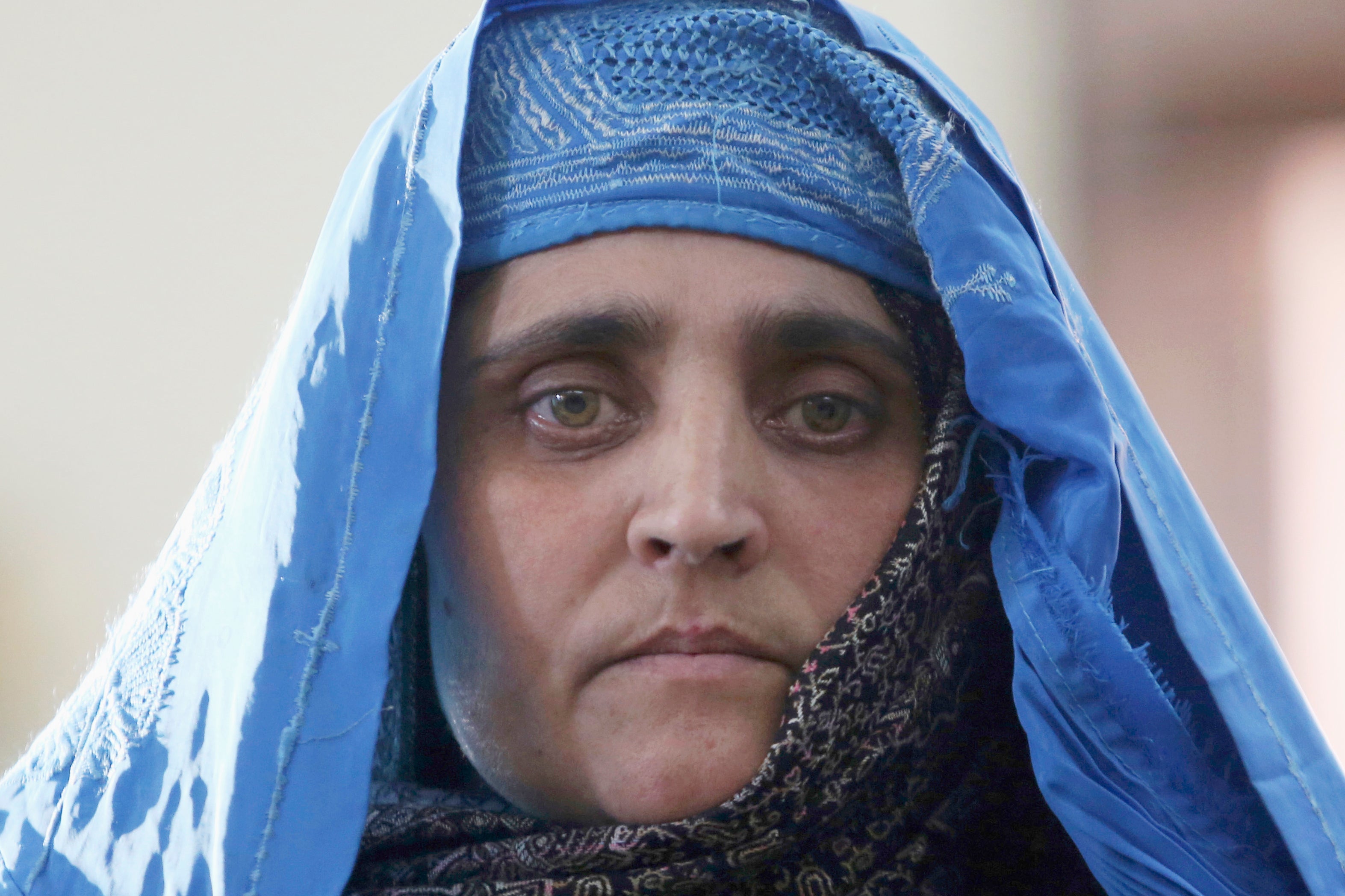 “Afghan Girl” Sharbat Gula posing for a photo in Kabul in 2016