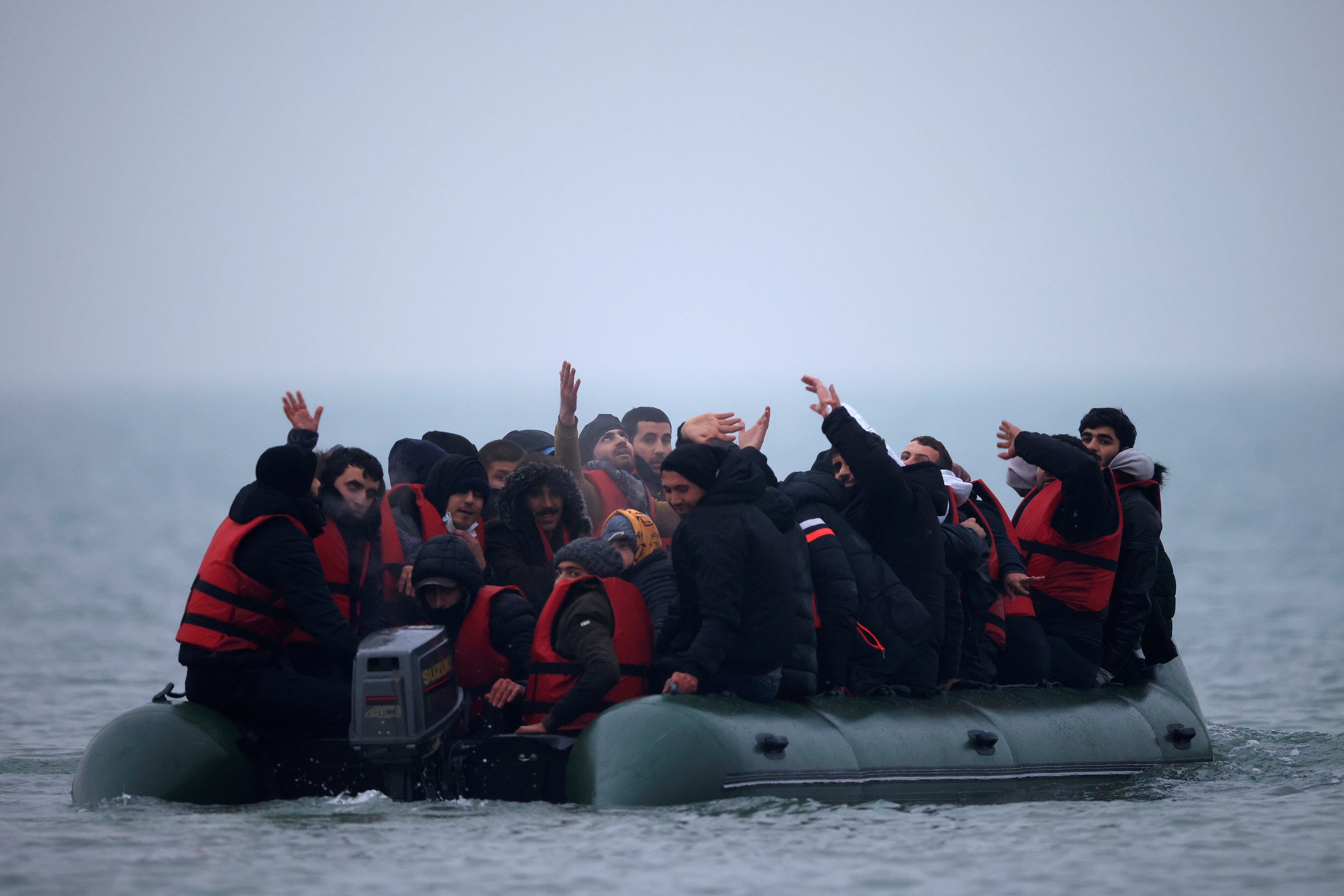 A dinghy heads out from the French coast to cross the English Channel