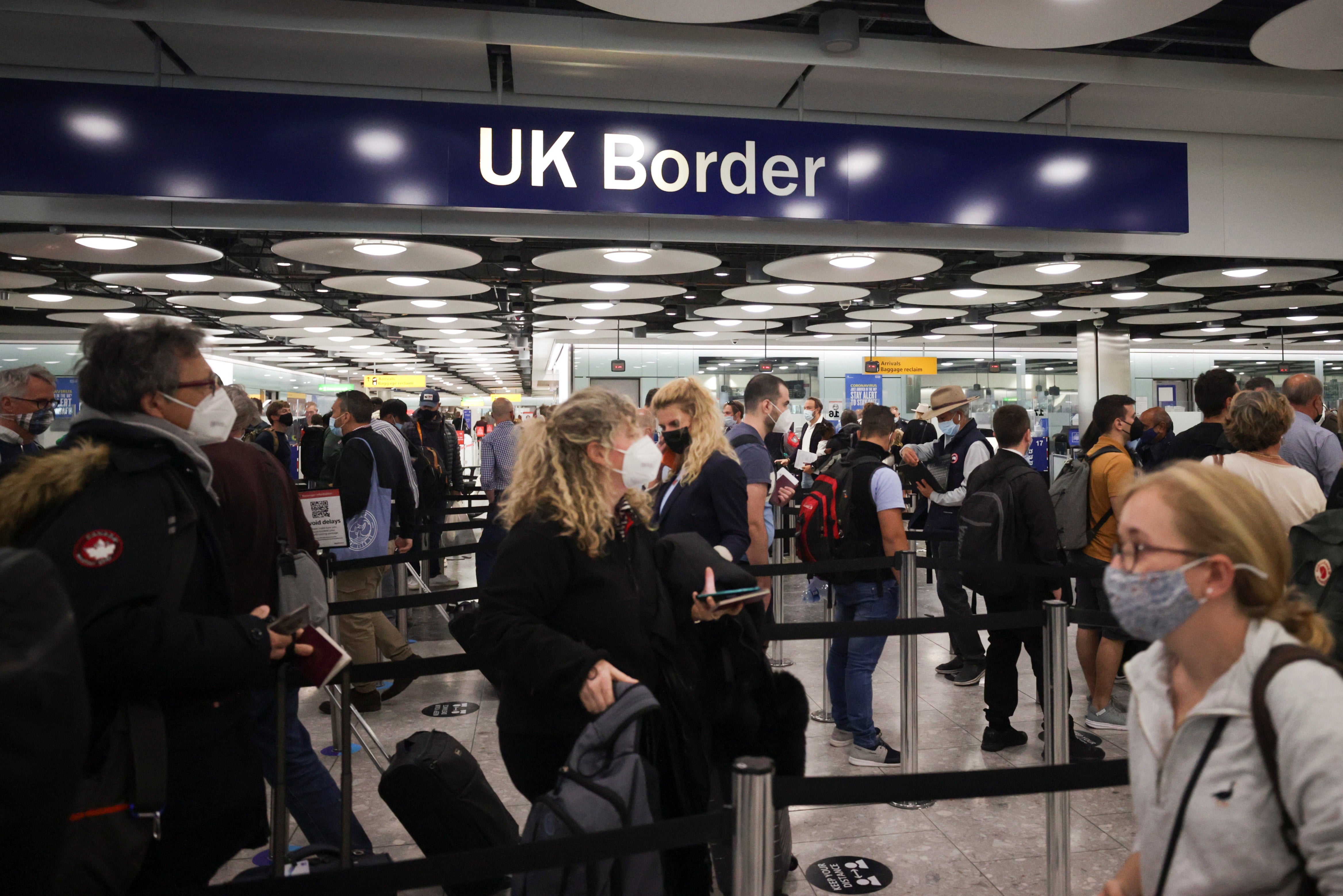 Arriving passengers queue at UK Border Control at Heathrow’s Terminal 5