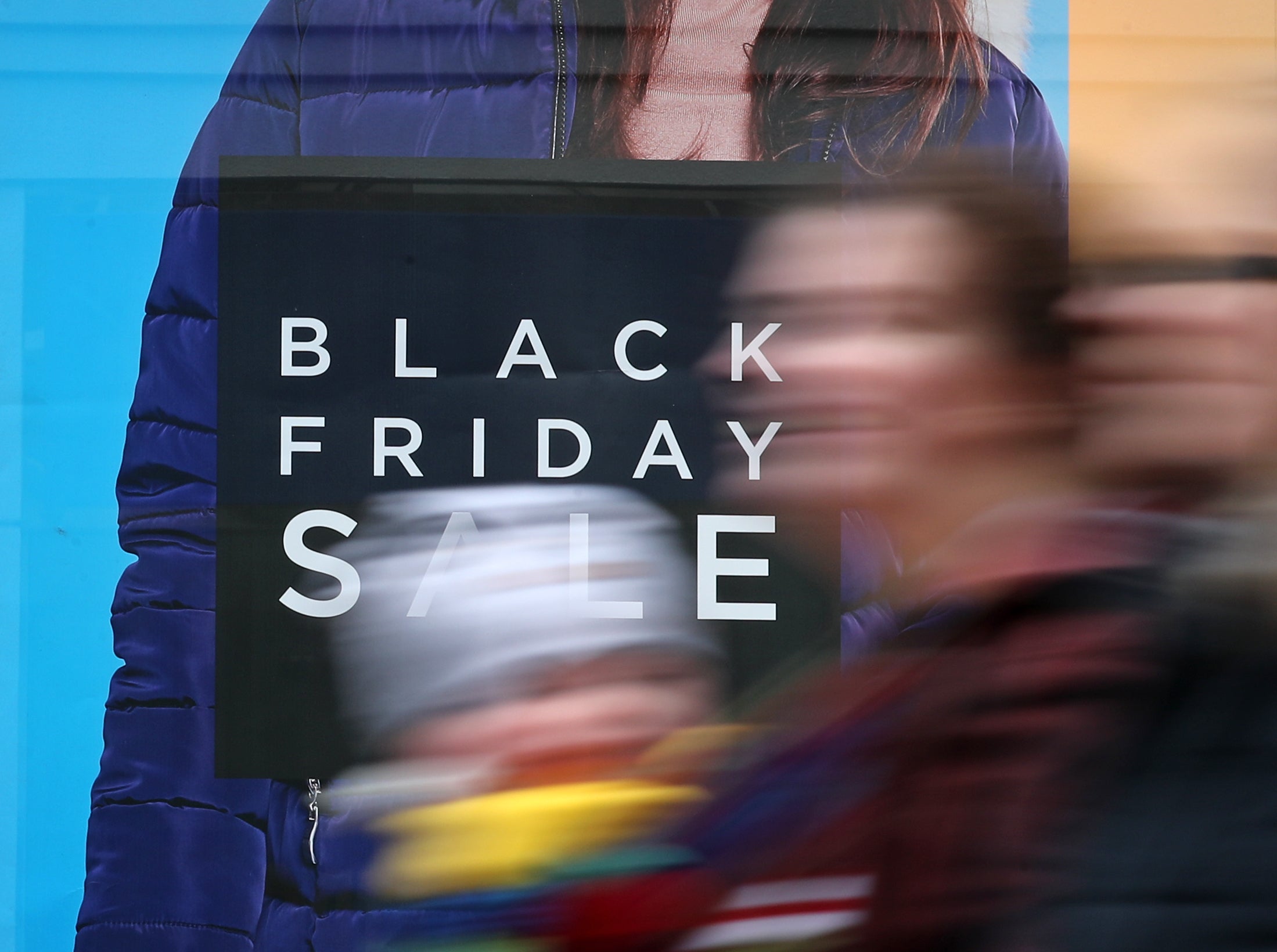 A shop displaying offer posters ahead of Black Friday sales (PA)