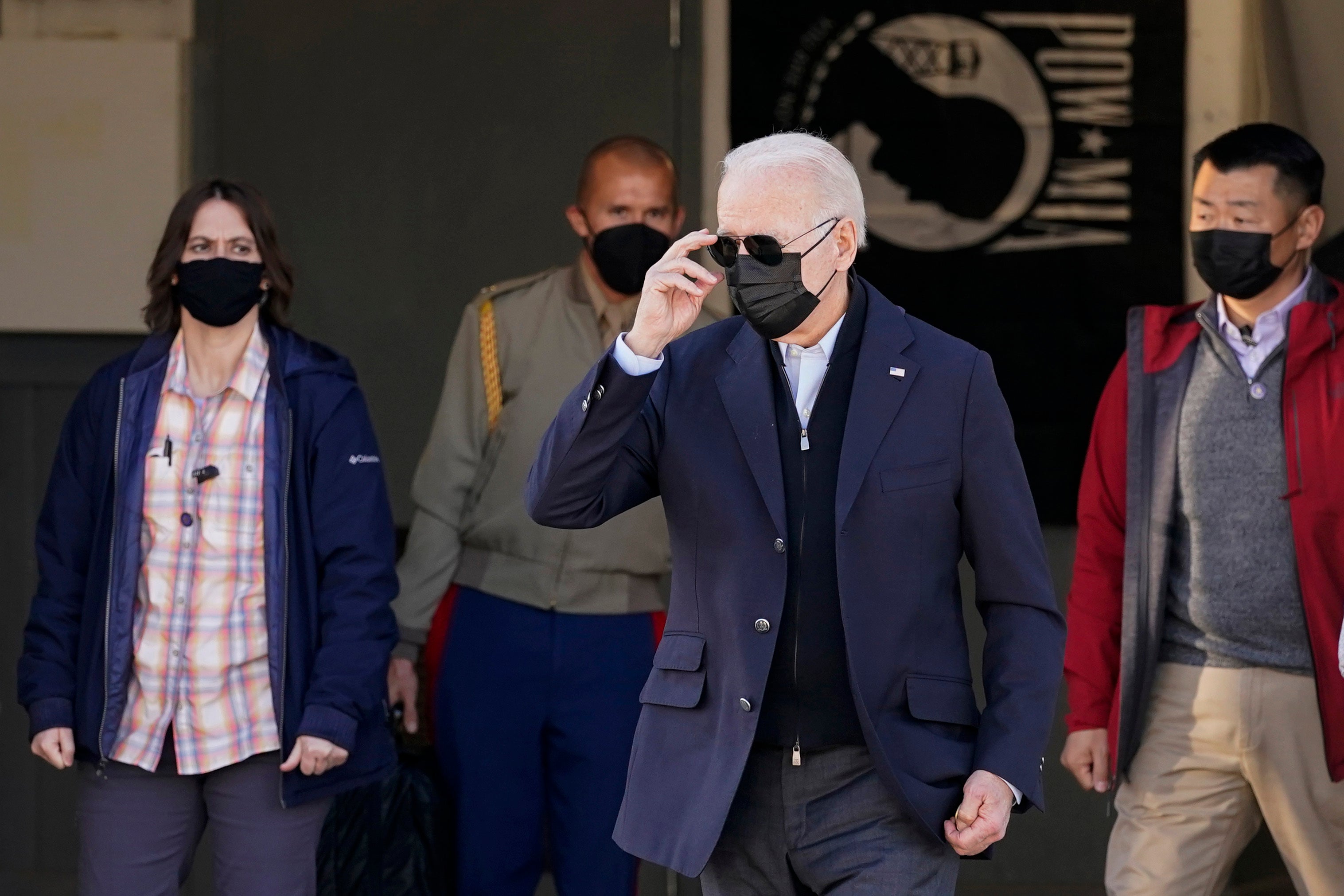 US President Joe Biden walks to greet members of the United States Coast Guard