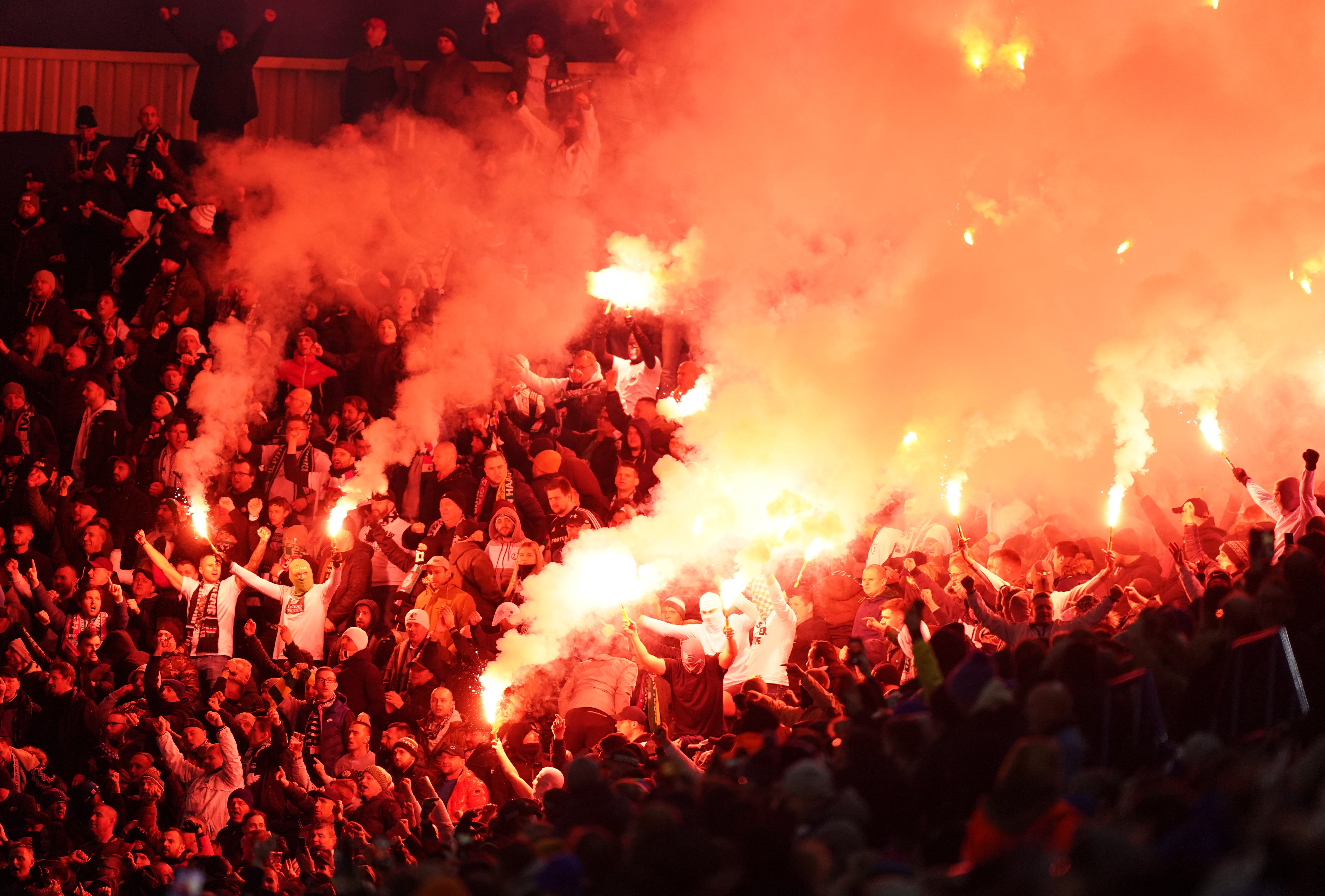 Legia Warsaw fans in the stands set off flares during the match at the King Power Stadium (Mike Egerton/PA)