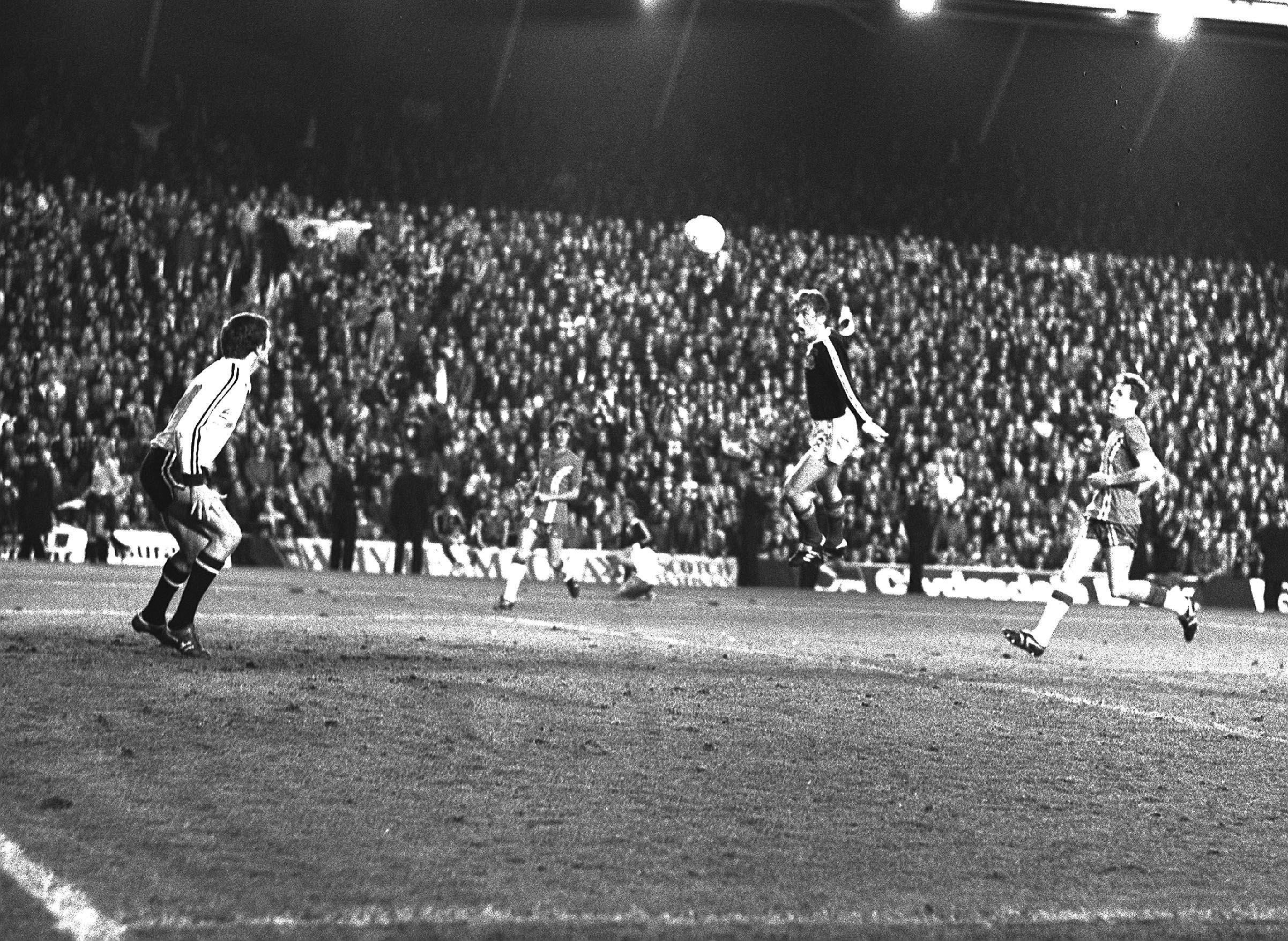 Kenny Dalglish heads home during Scotland’s 2-0 win against Wales in a 1978 World Cup qualifier played at Anfield (PA)