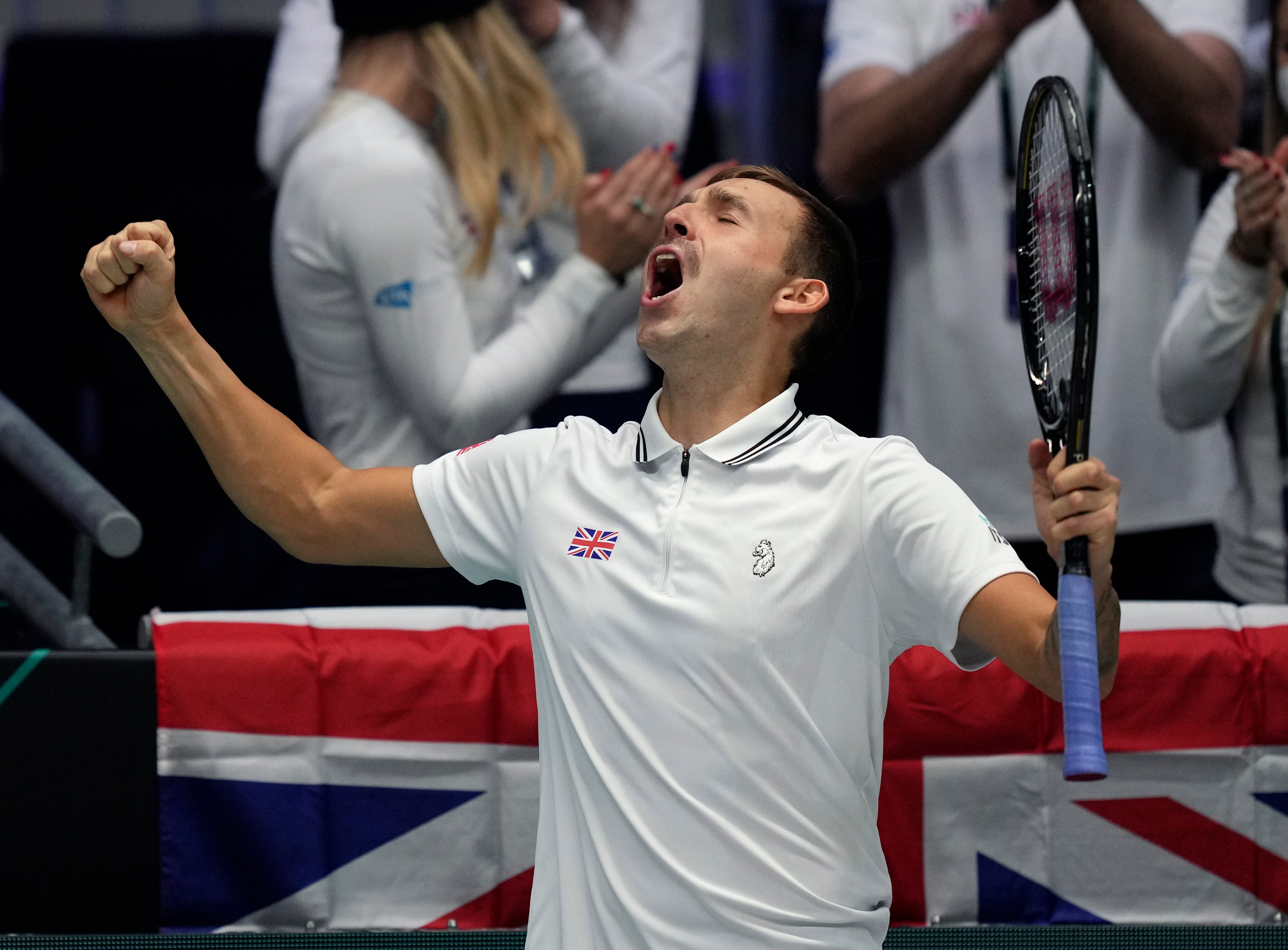 Dan Evans celebrates victory over Adrian Mannarino (Michael Probst/AP)