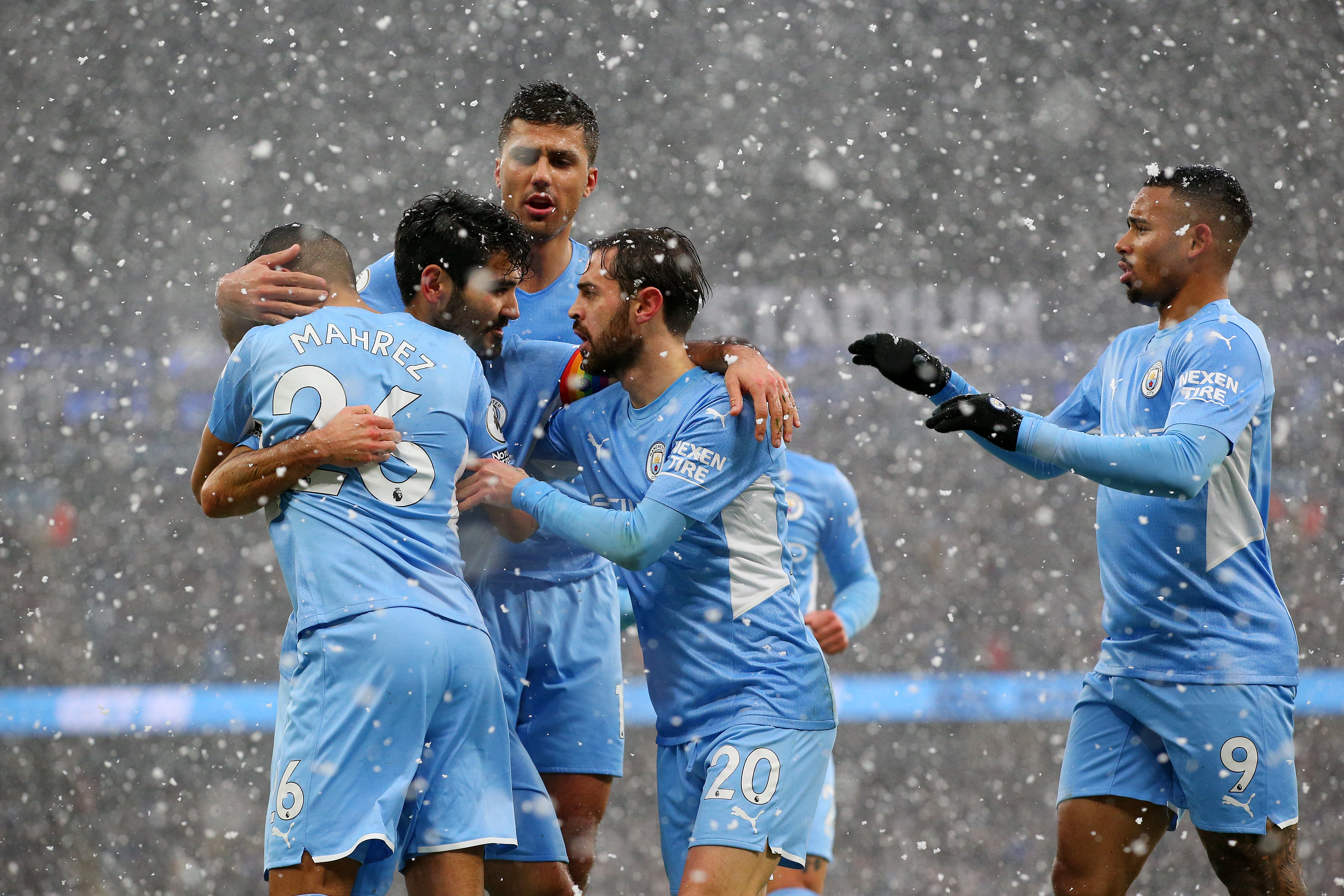 Gundogan (second left) is congratulated by teammates