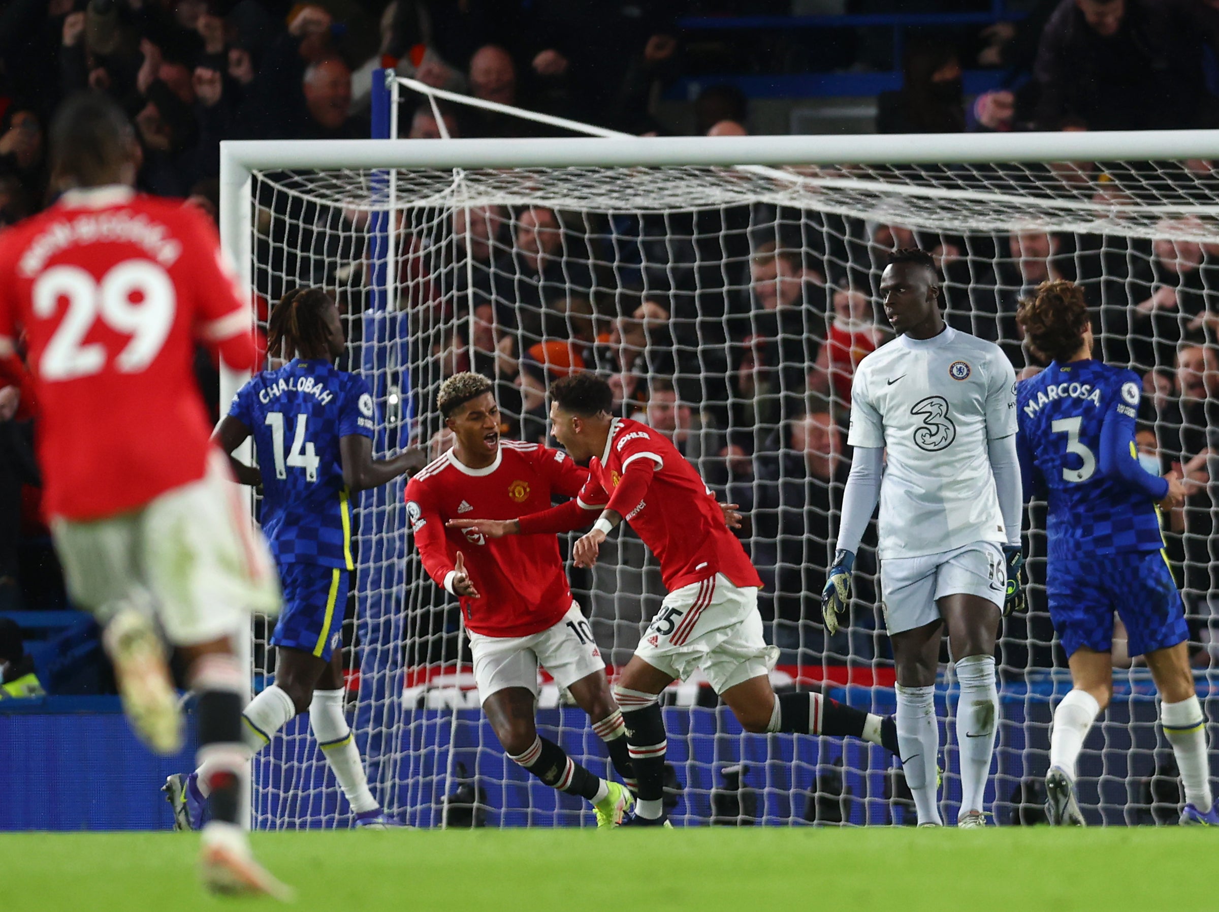 Marcus Rashford rushes to celebrate with Sancho