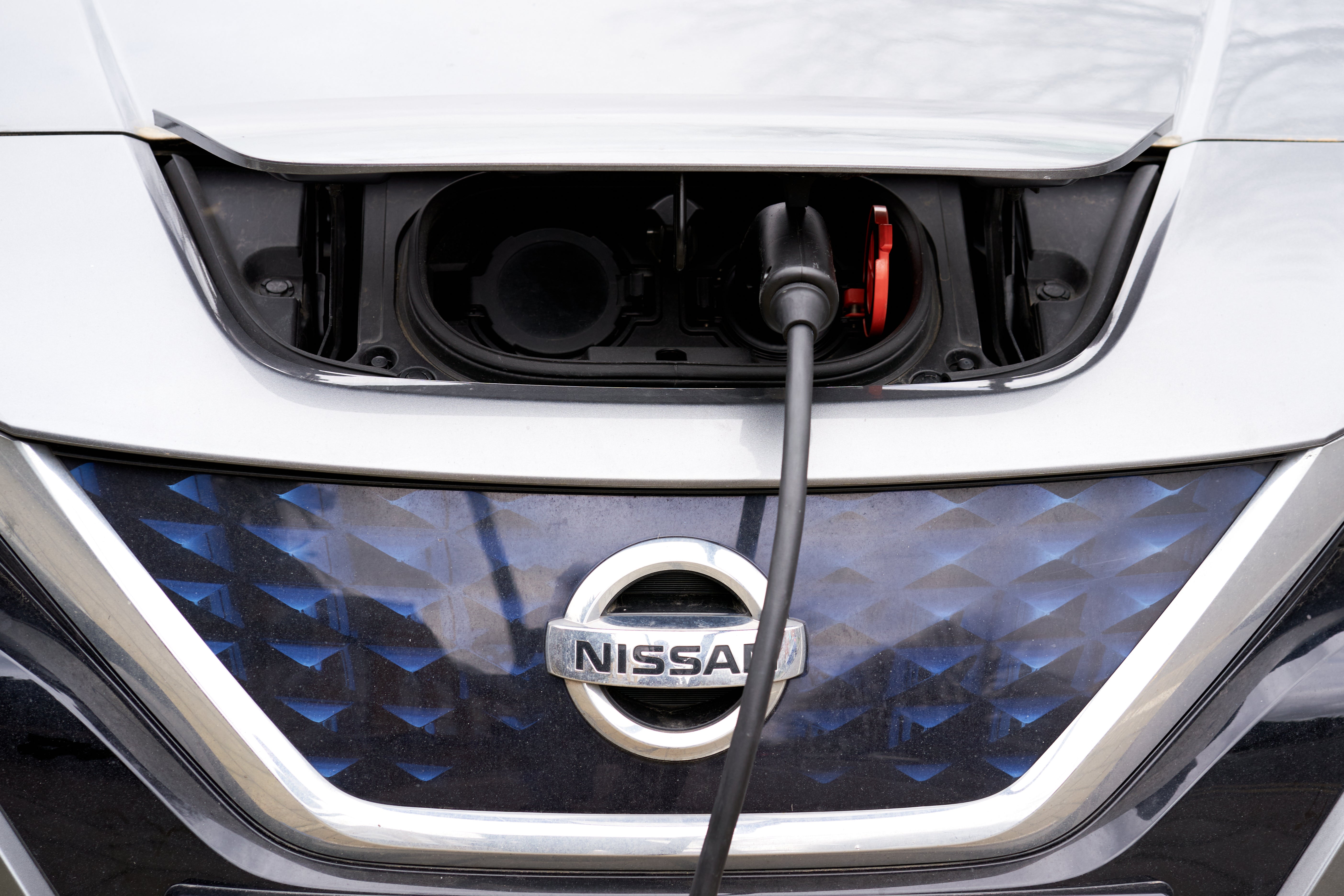 Nissan has announced plans to invest billions in electric car production (PA)