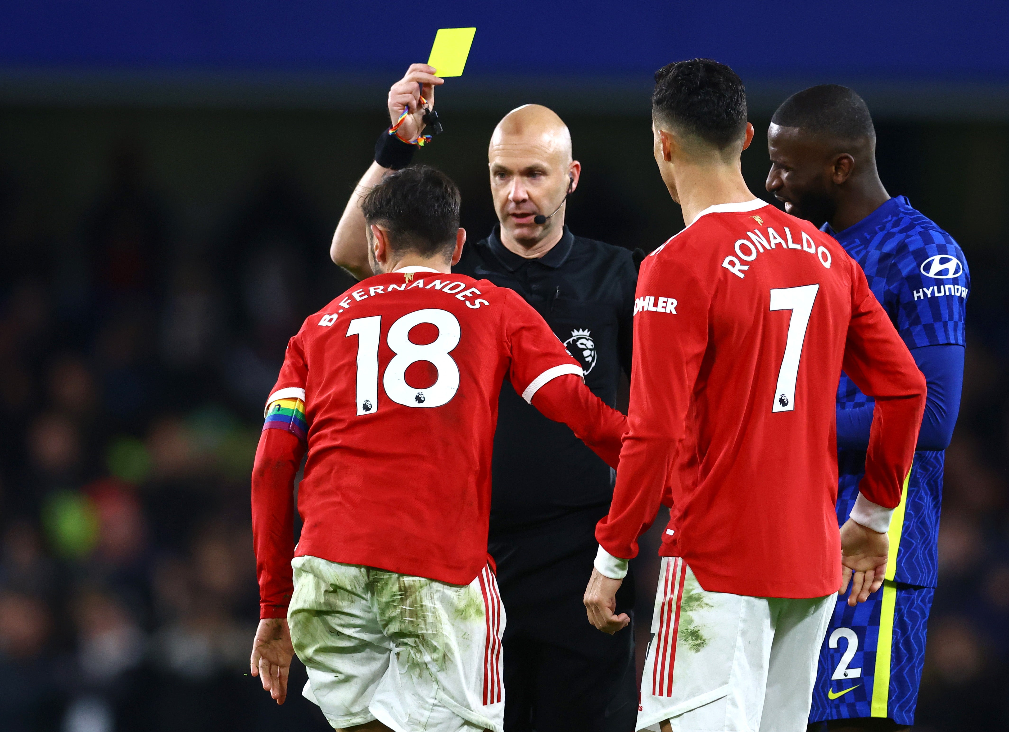 Bruno Fernandes is shown a yellow card by referee Anthony Taylor