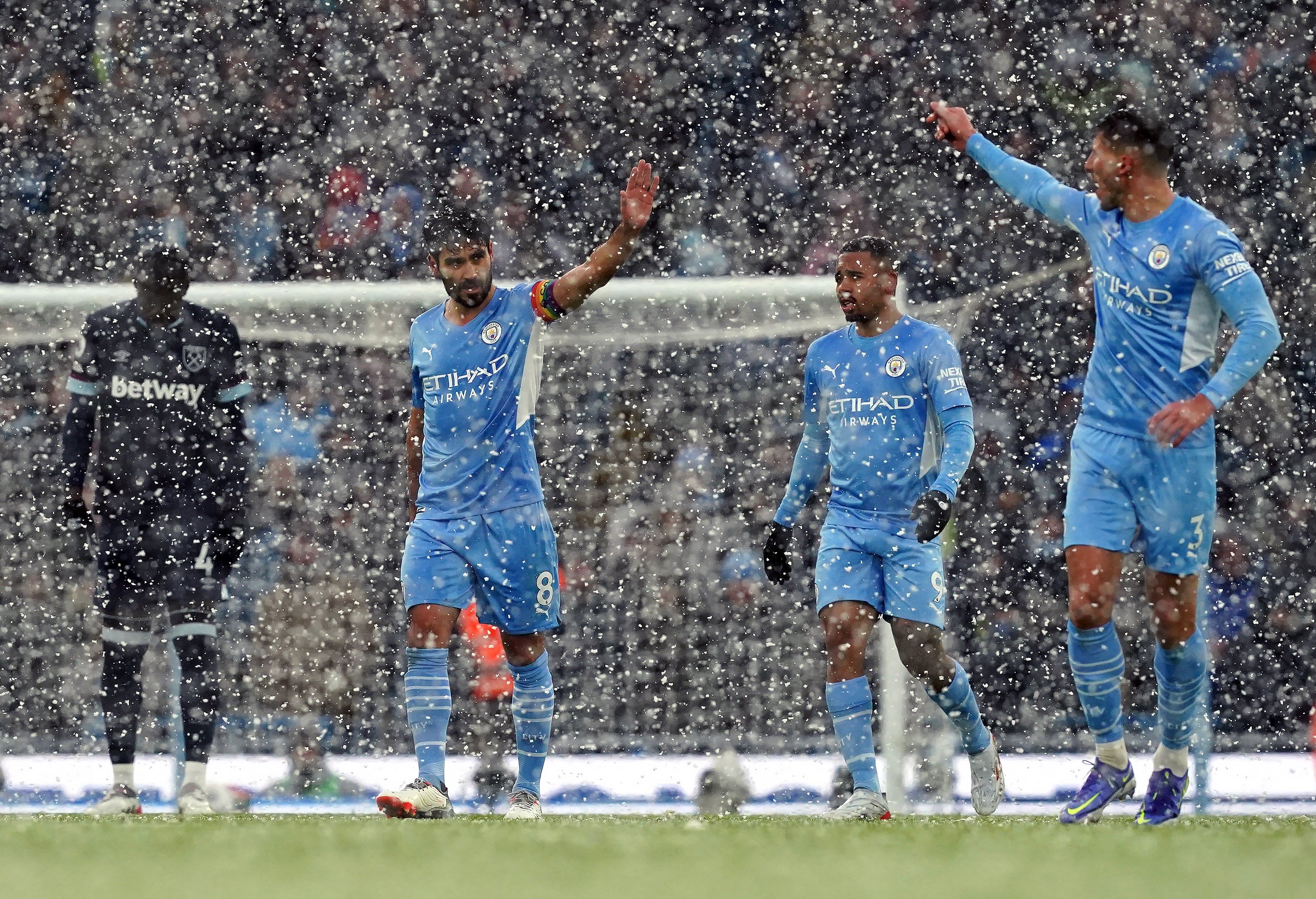 Manchester City weathered the snow to claim a hard-fought win over West Ham (Martin Rickett/PA)