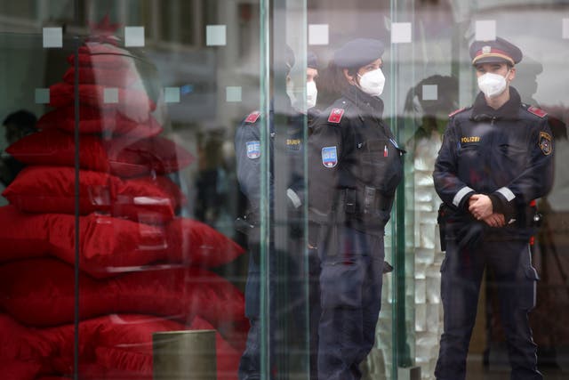 <p>Police stand at the entrance of Palais Coburg, the site of a meeting of the Iran nuclear talks</p>