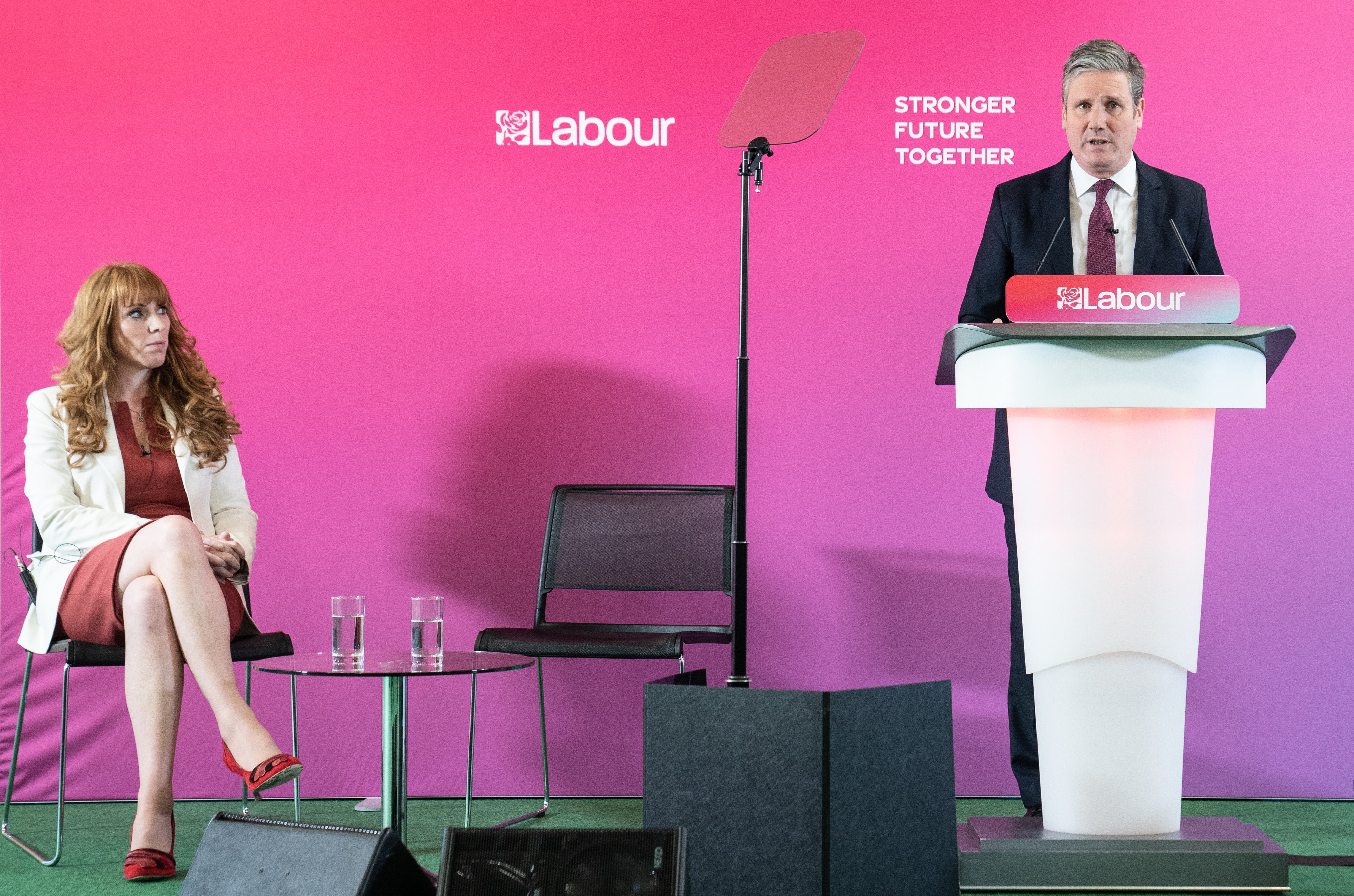 Labour deputy leader Angela Rayner listens as Labour leader Keir Starmer gives a speech