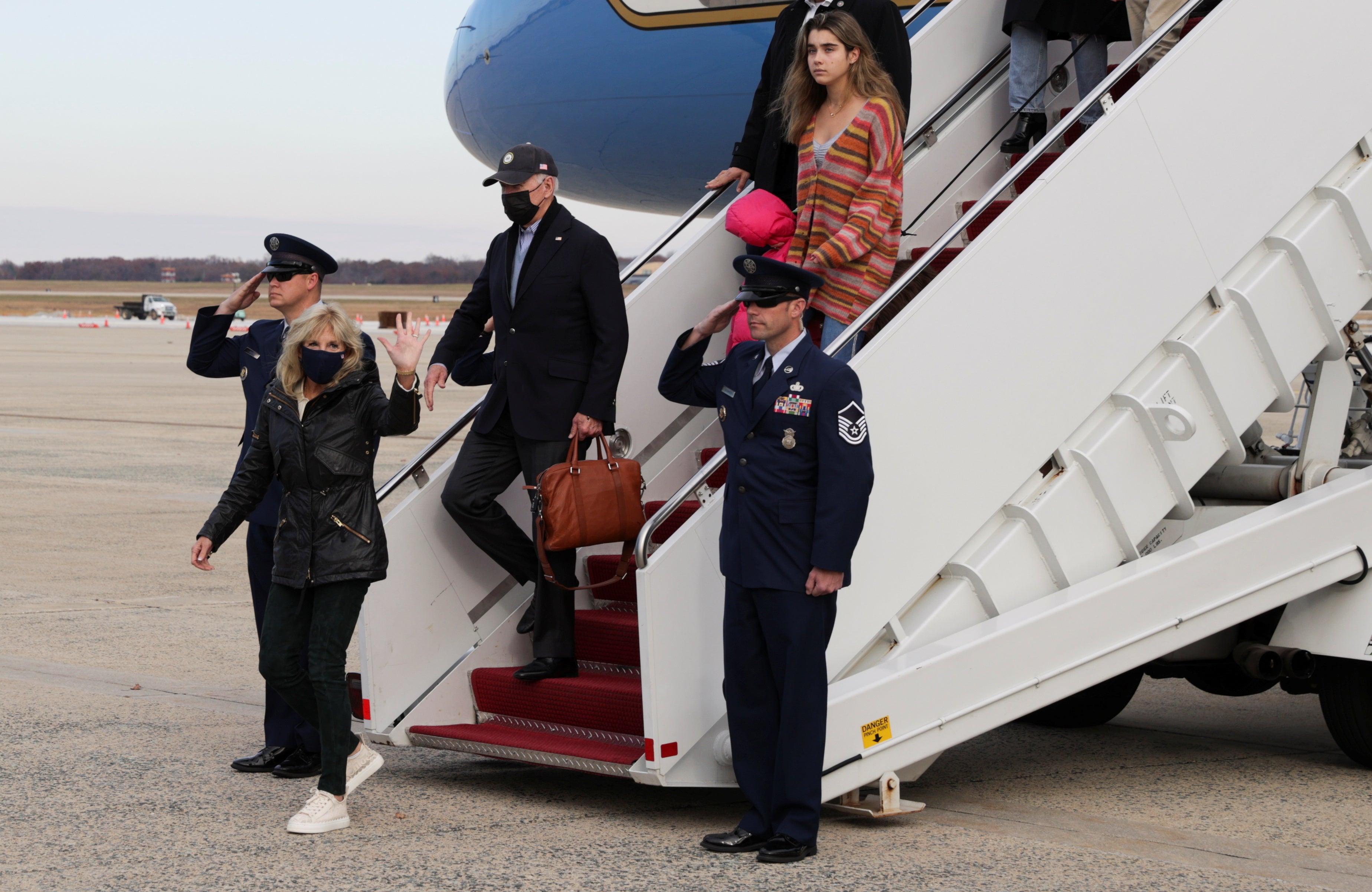 Omicron news - live: Biden tells Americans variant ‘not a cause for panic’ as CDC urges vaccines