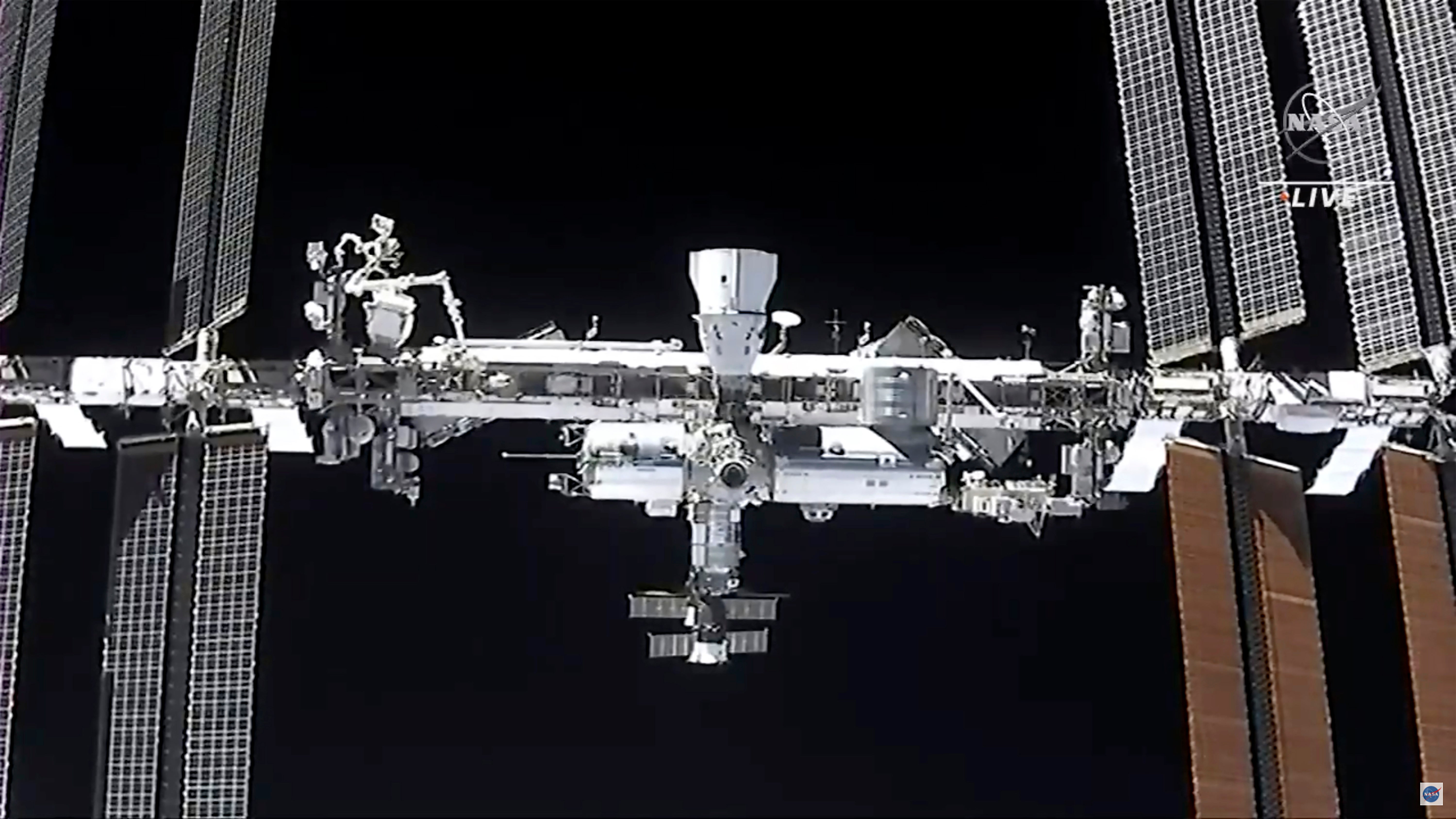 This image made from NASA TV shows the international space station, seen from the SpaceX Crew Dragon spacecraft Saturday, April 24, 2021.