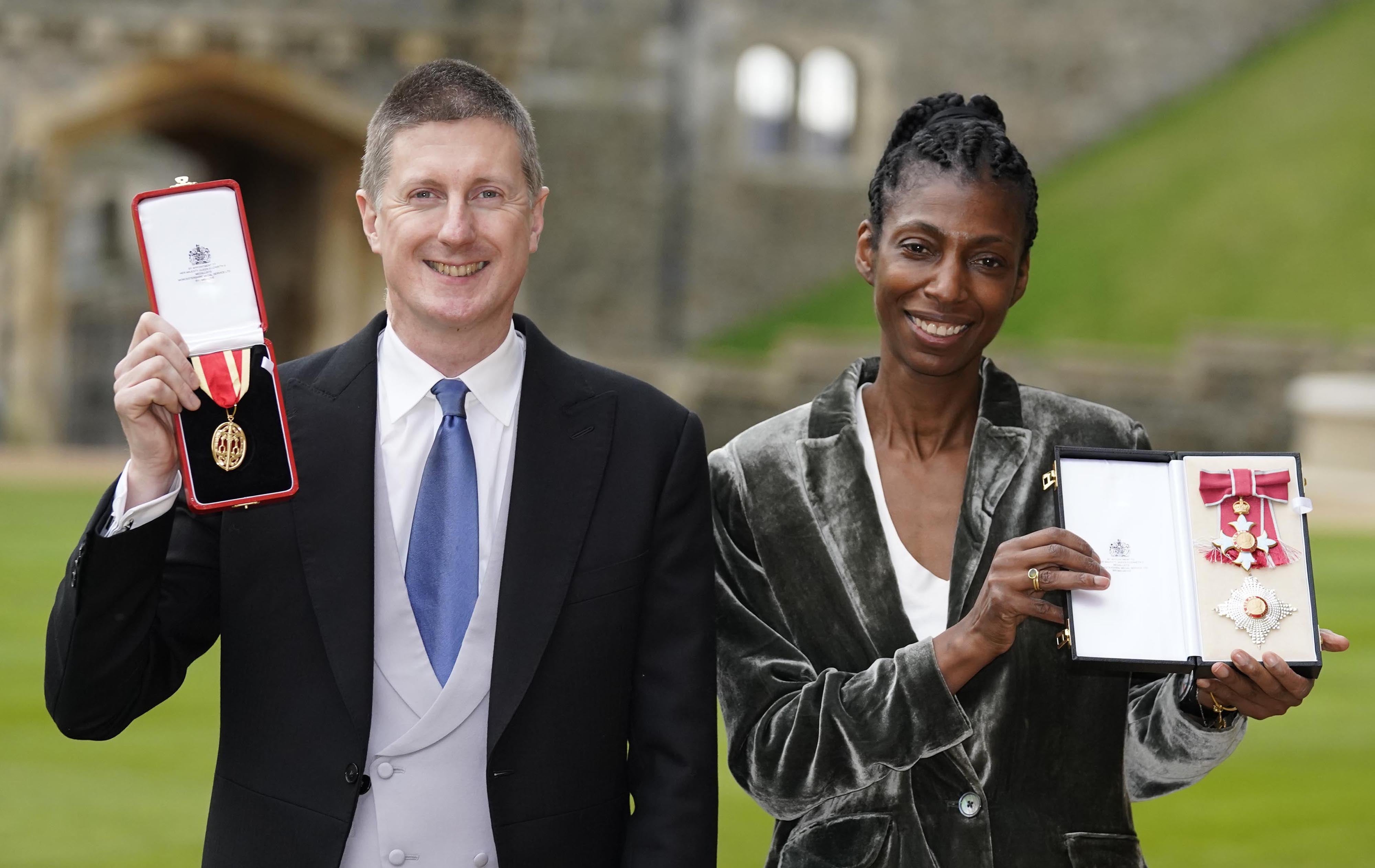 Dame Sharon White and her husband Sir Robert Chote with the awards they received at an investiture ceremony at Windsor Castle (Andrew Matthews/PA)