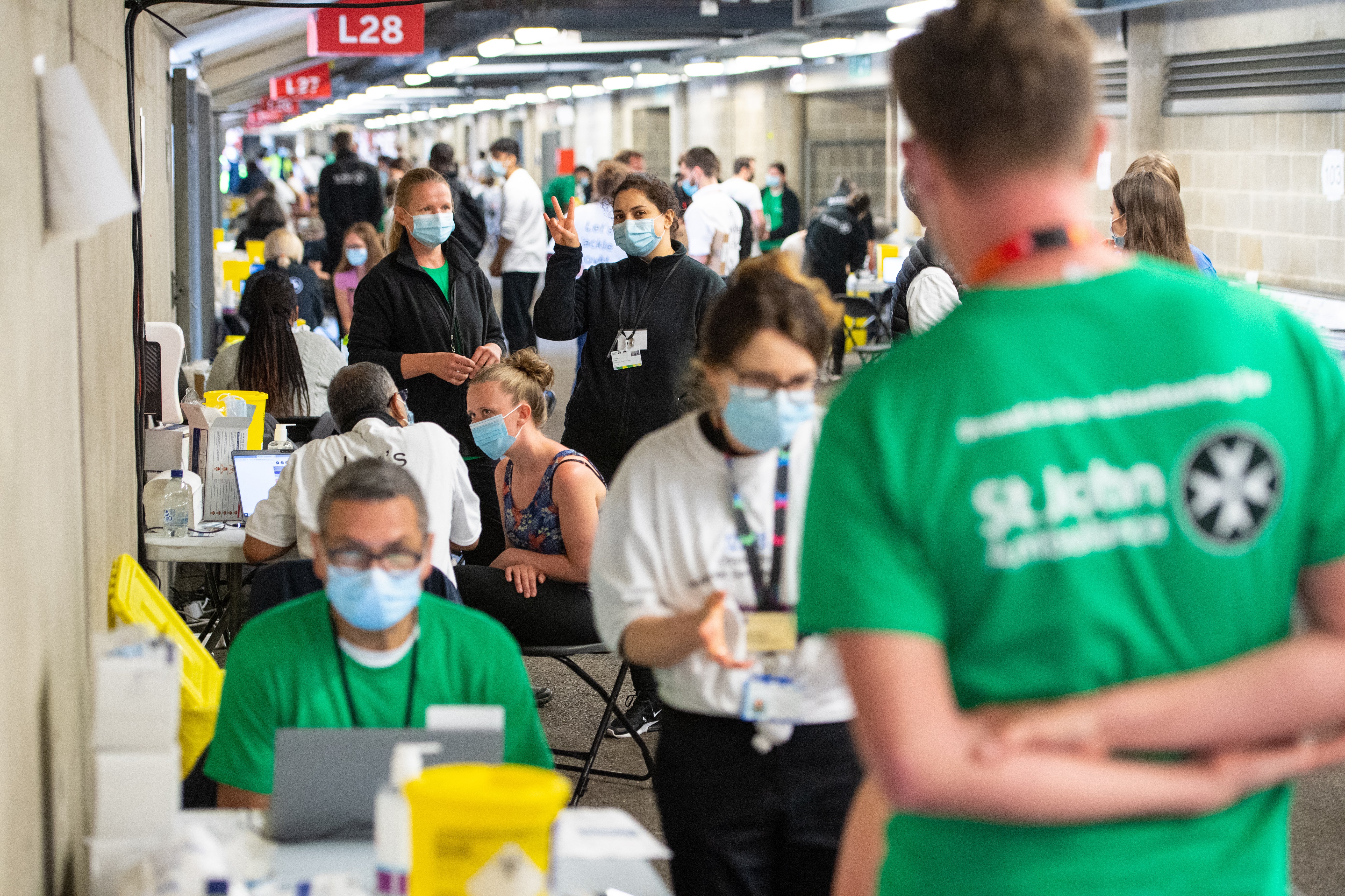 Staff and volunteers at work at a coronavirus vaccination centre at Twickenham rugby stadium (Dominic Lipinski/PA)