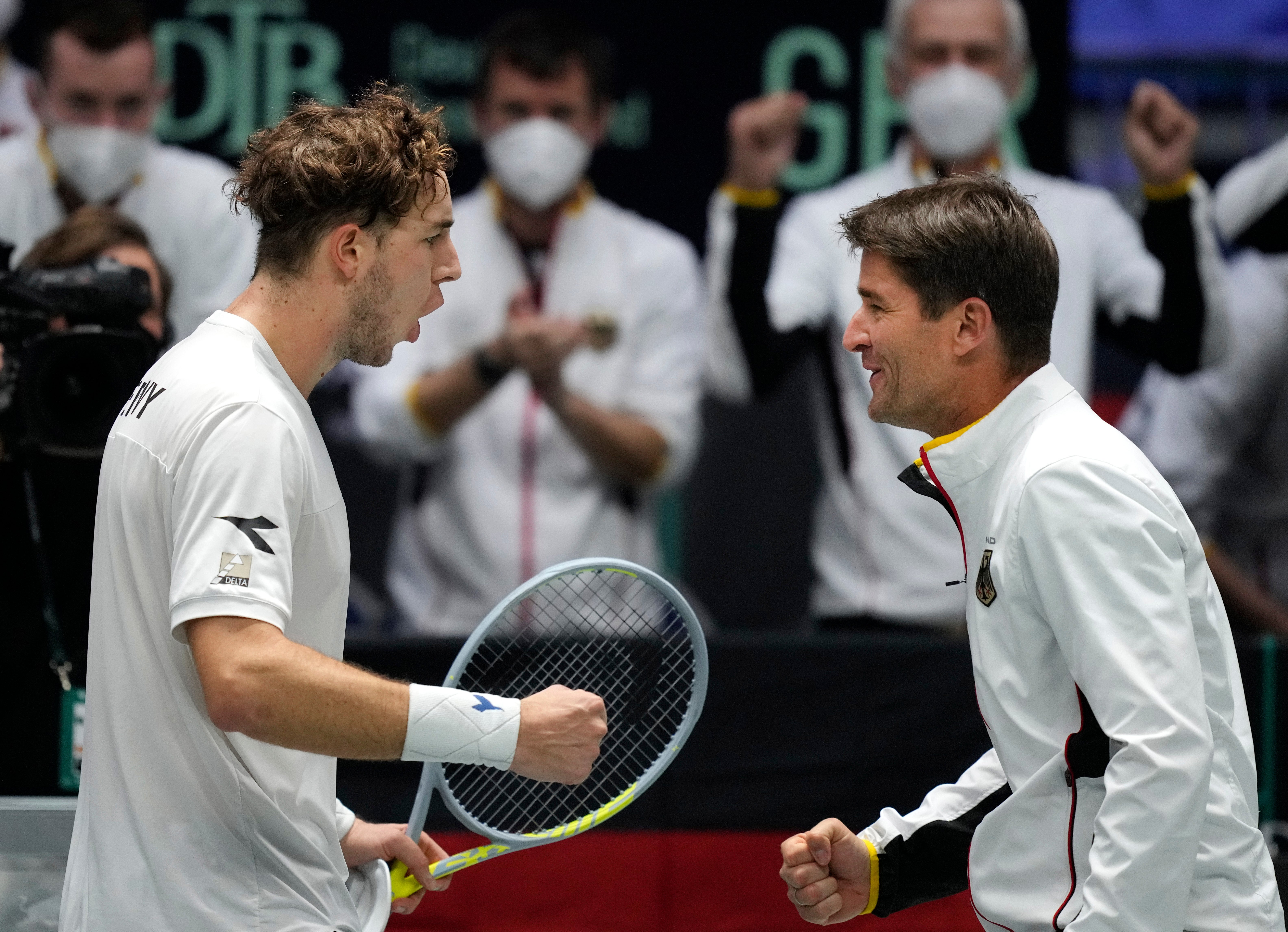 Jan-Lennard Struff, left, celebrates his big win over Cameron Norrie (Michael Probst/AP)