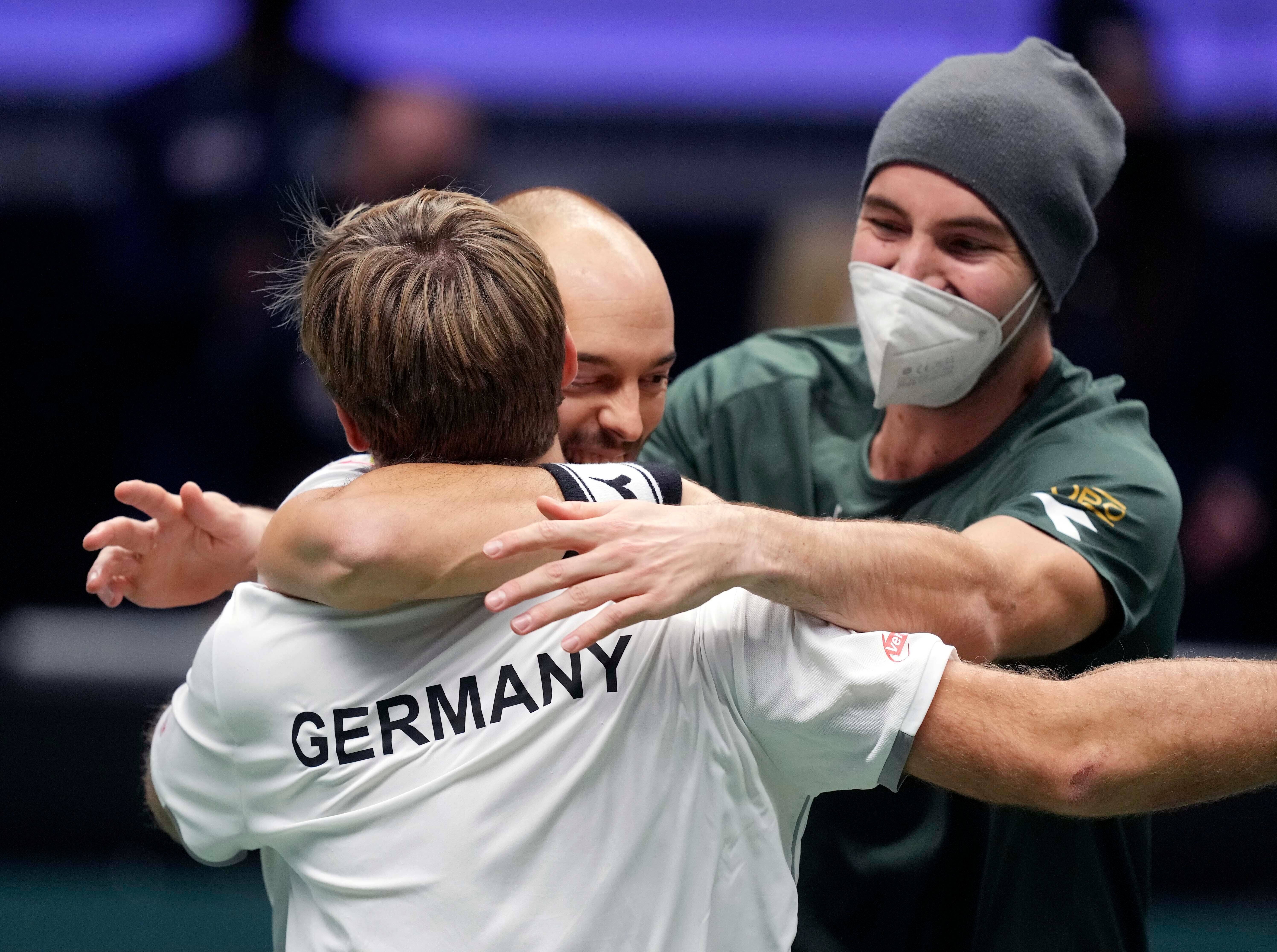 Germany’s Kevin Krawietz, Tim Puetz and Jan-Lennard Struff celebrate beating Great Britain (Michael Probst/AP)