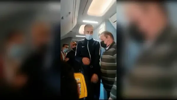 The man in the video before he alarms passengers by running to the front of the plane