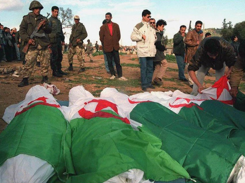 Bodies of some of the 18 civilians massacred in the seaside town of Douaouda, 18 miles from Algiers