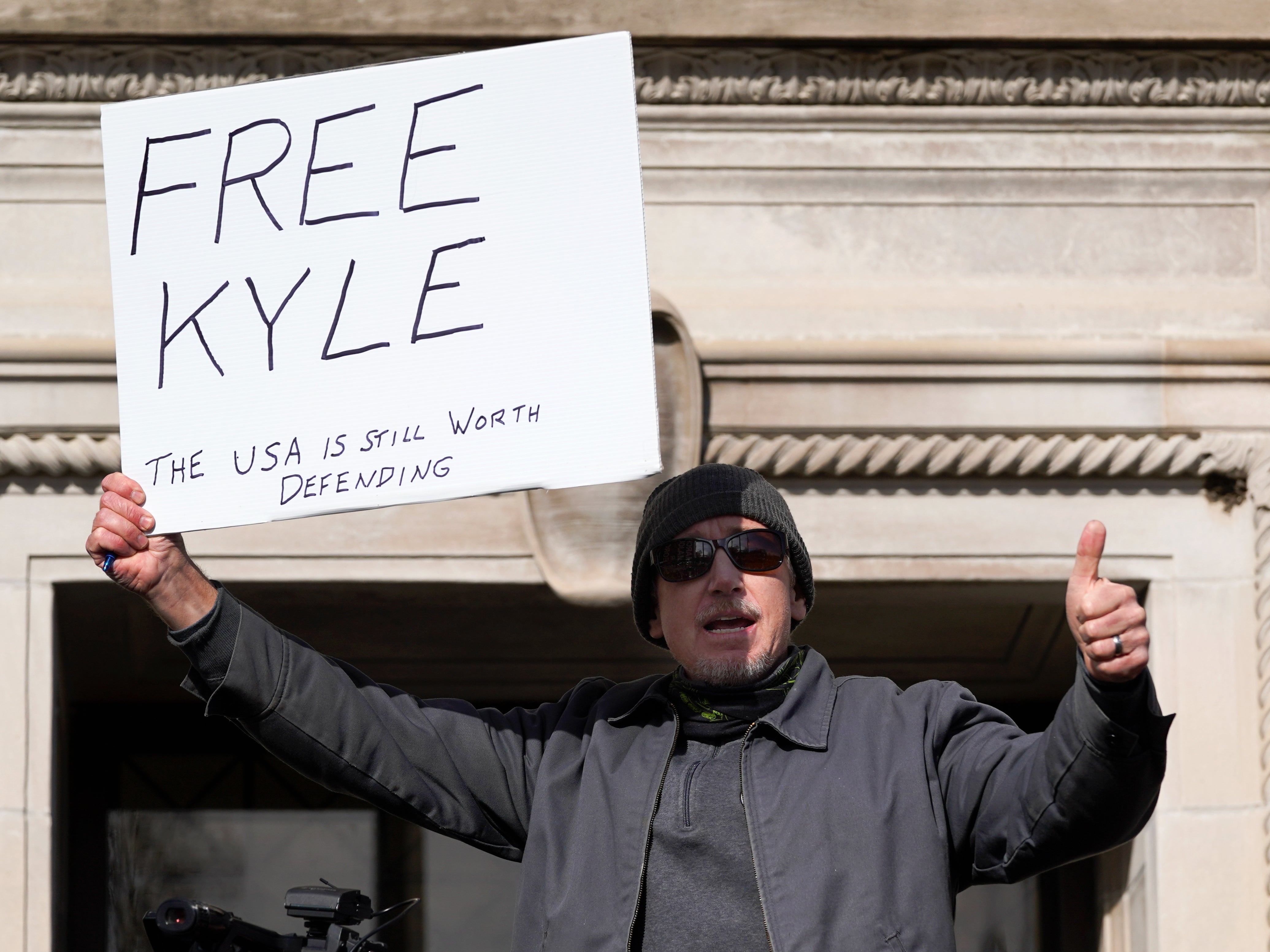 A supporter of Kyle Rittenhouse reacts to the not guilty verdict outside the Kenosha County Courthouse on Friday, 19 November 2021