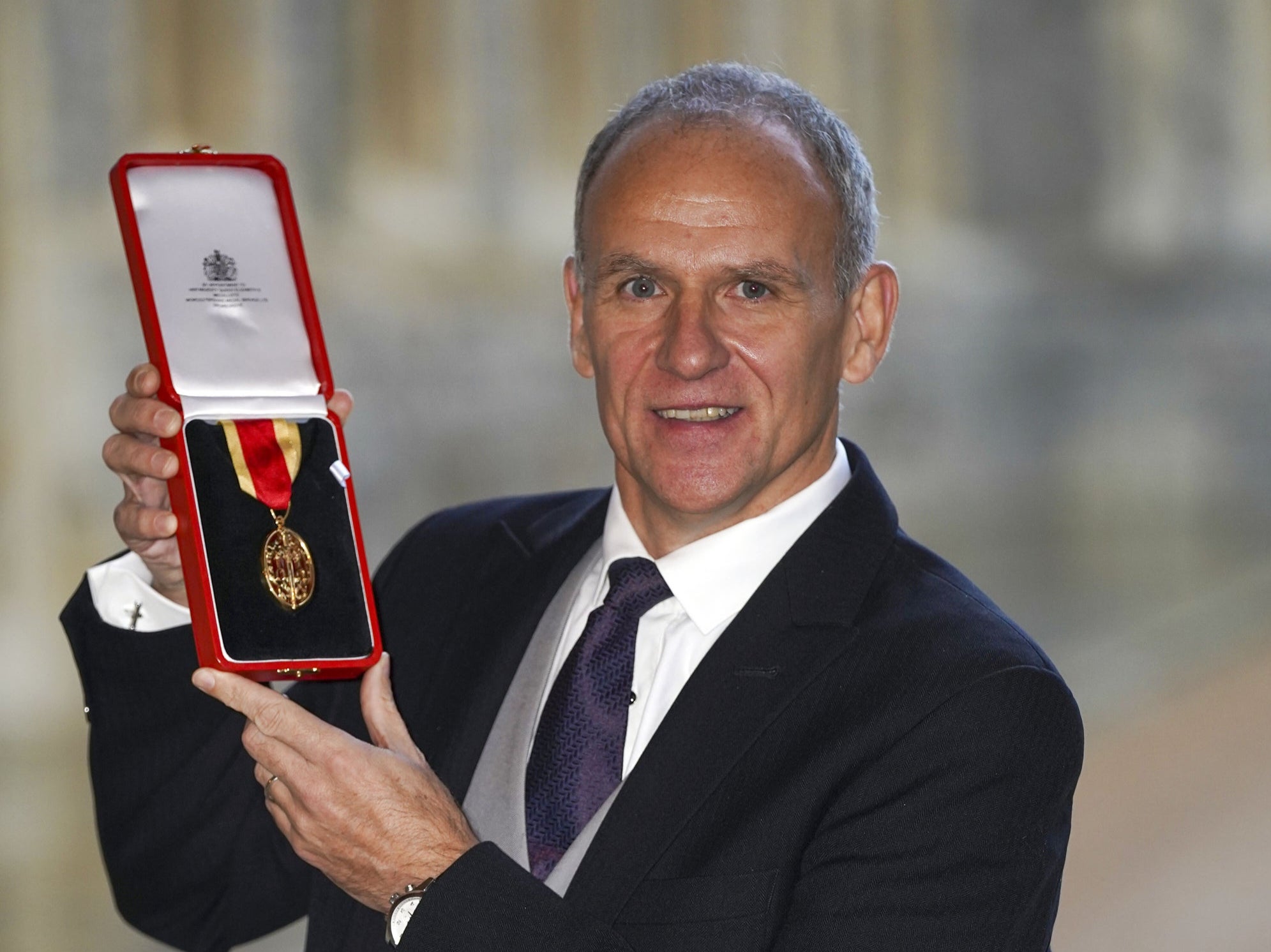 Sir David Lewis shows off his honour (Steve Parsons/PA)