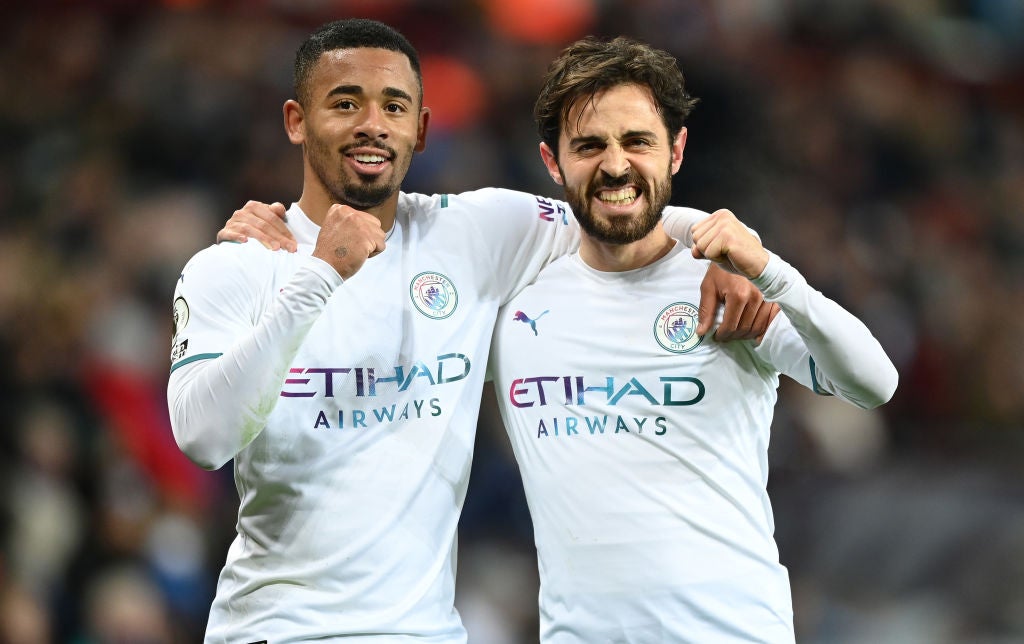 Gabriel Jesus, left, and Bernardo Silva celebrate victory